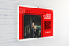 Red gym advertisement board featuring a woman lifting weights, with bold text reading "Gym Fitness Strong," a QR code, and the call to action "Join Now."