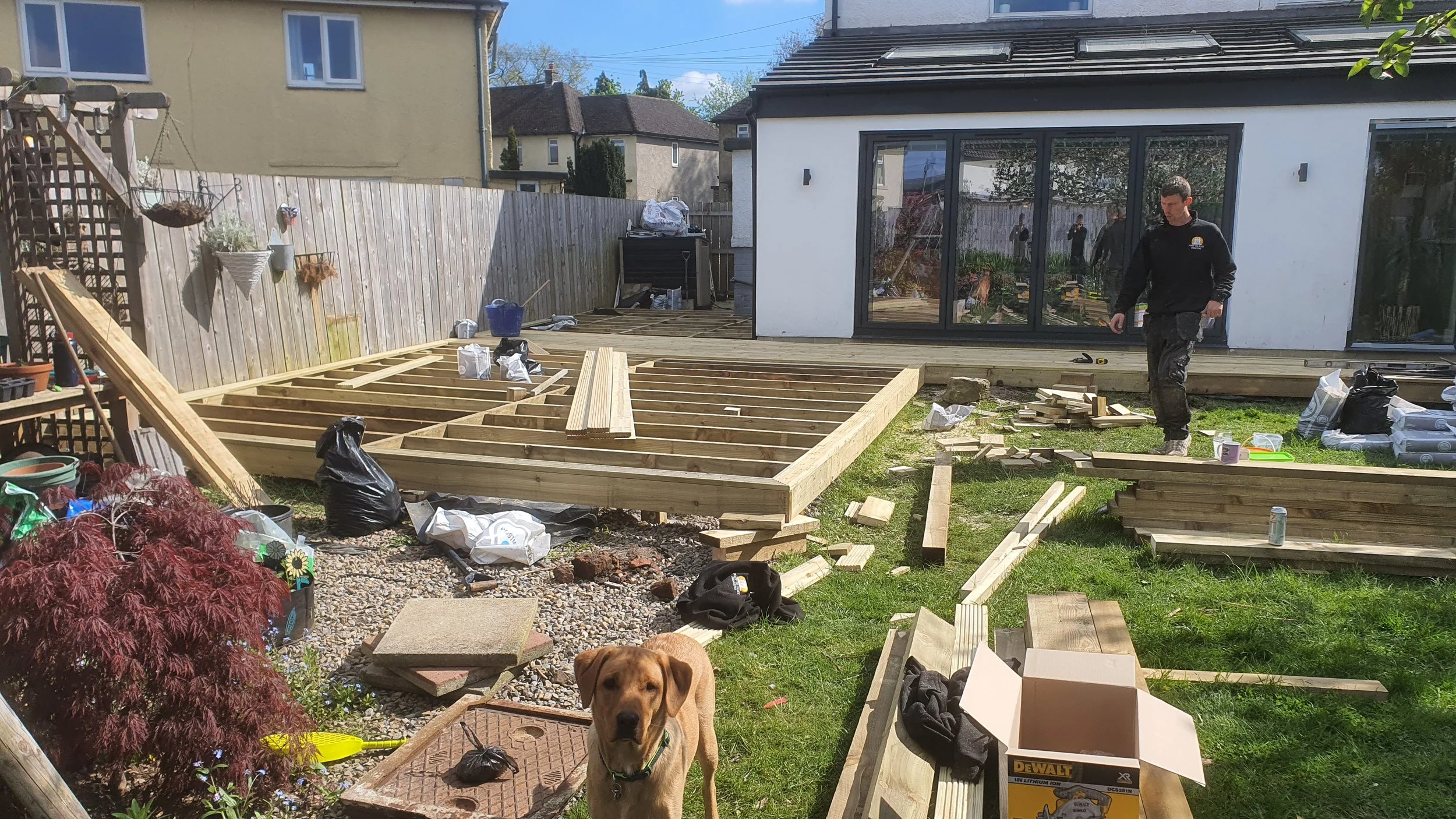 Picture framed decking boards with garden fencing and seating area