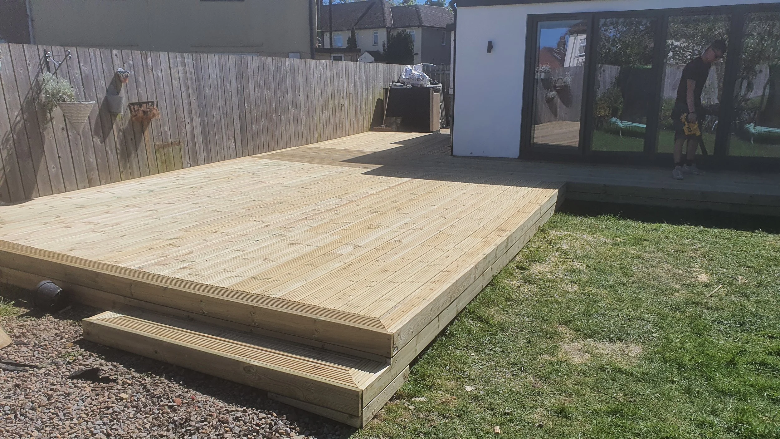 Full garden renovation with decking, fencing, turf and raised planters