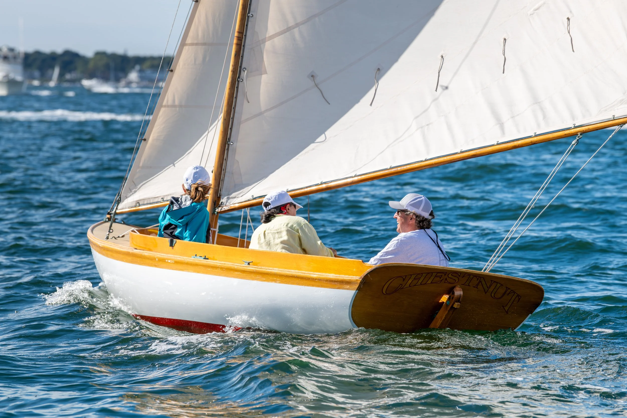 Chestnut, a Herreshoff 12 1/2 sailing in Newport , Rhode Island.