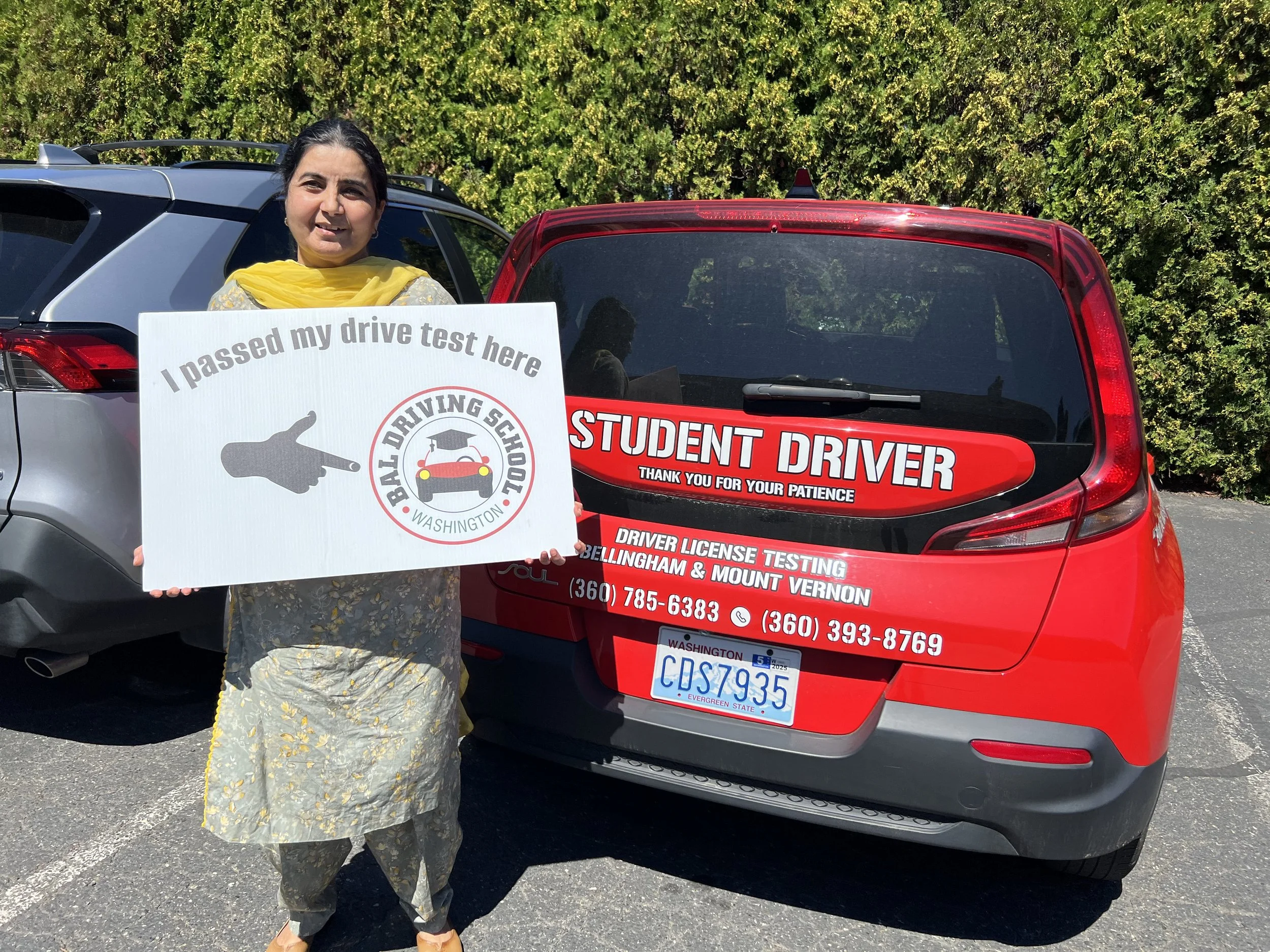 Applicant preparing for a DOL driving test near me in Washington with a Bal Driving School vehicle