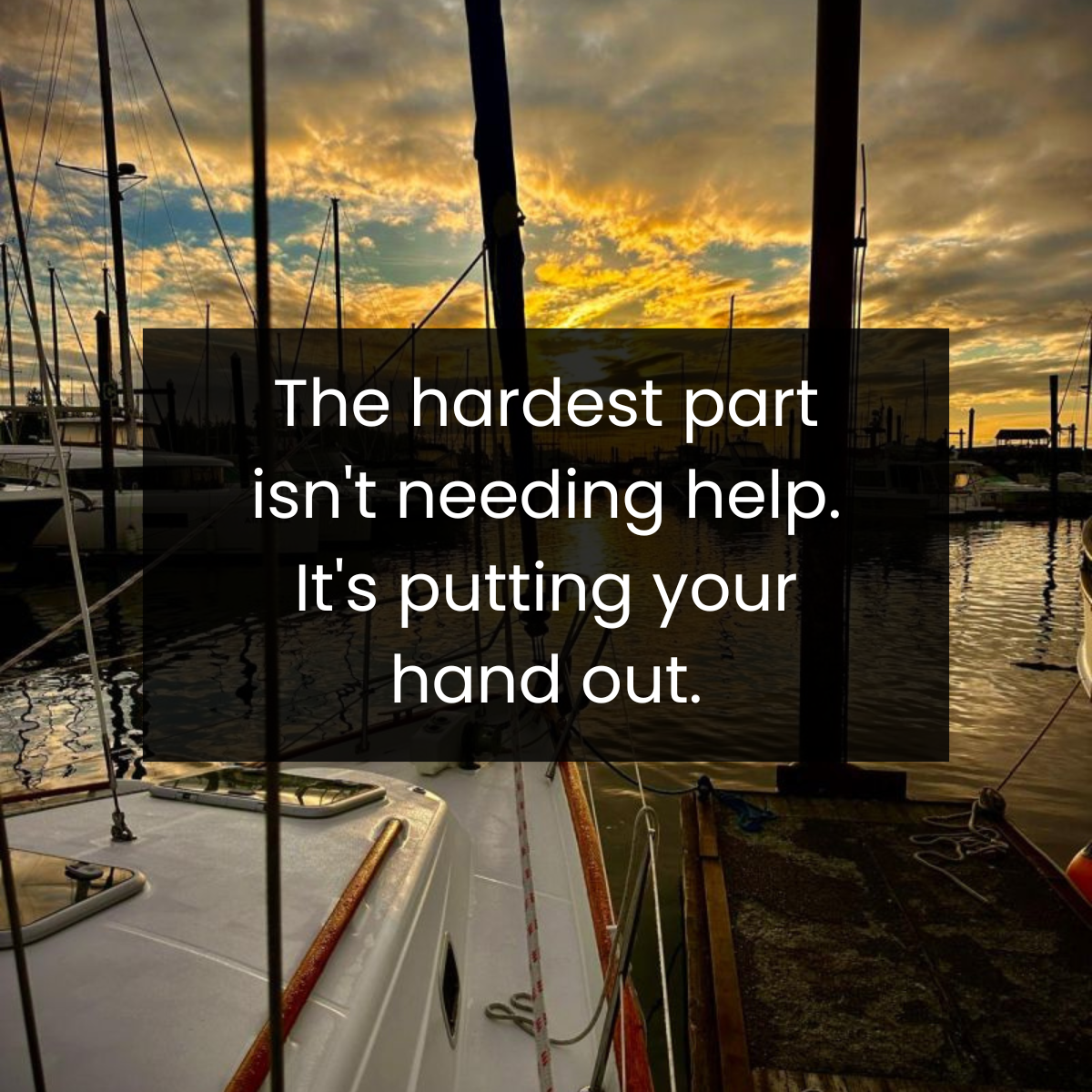 A marina at sunset with boats docked and clouds in the sky.