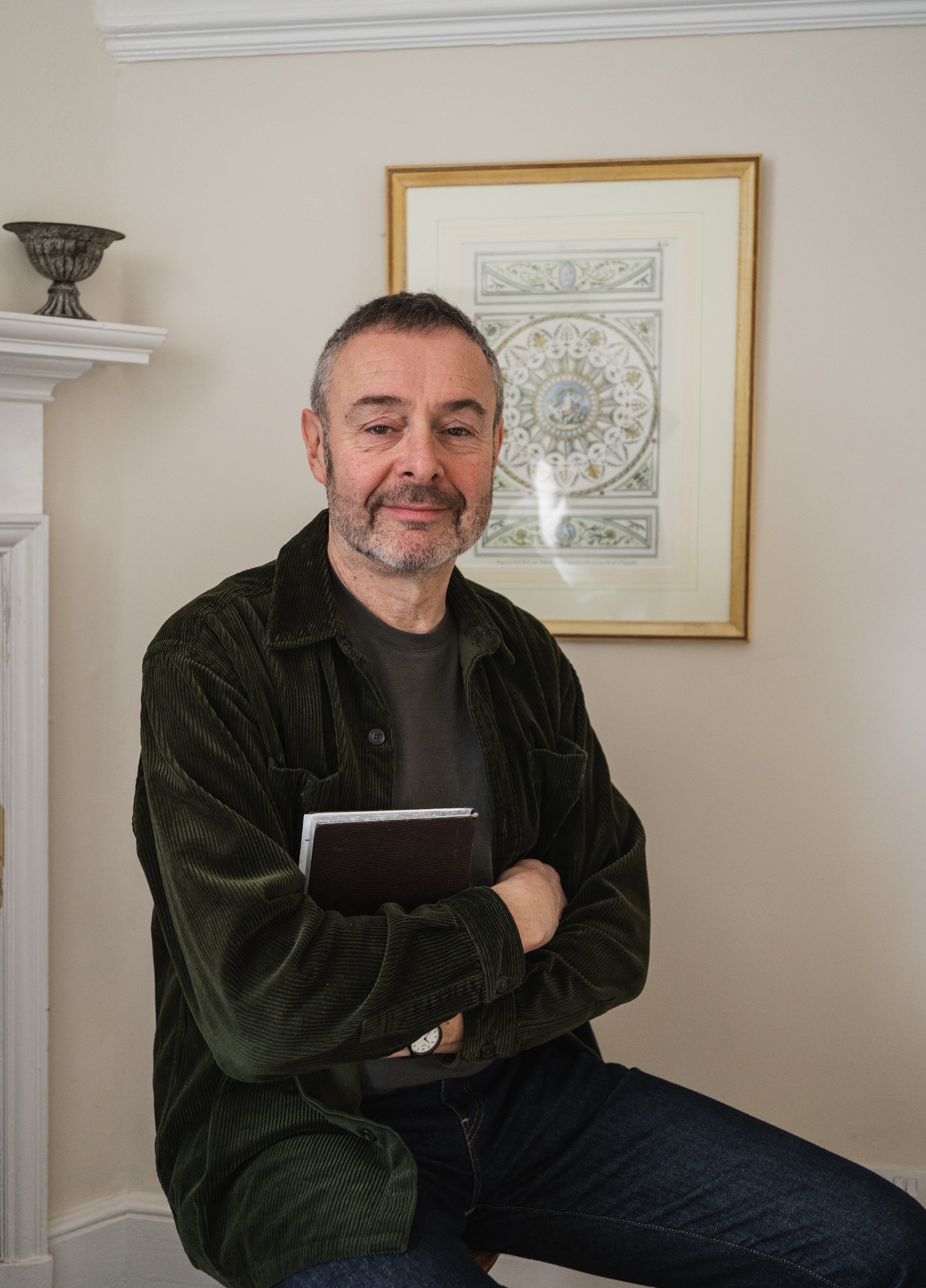 David Morris, humanistic counsellor, seated in a counselling room.