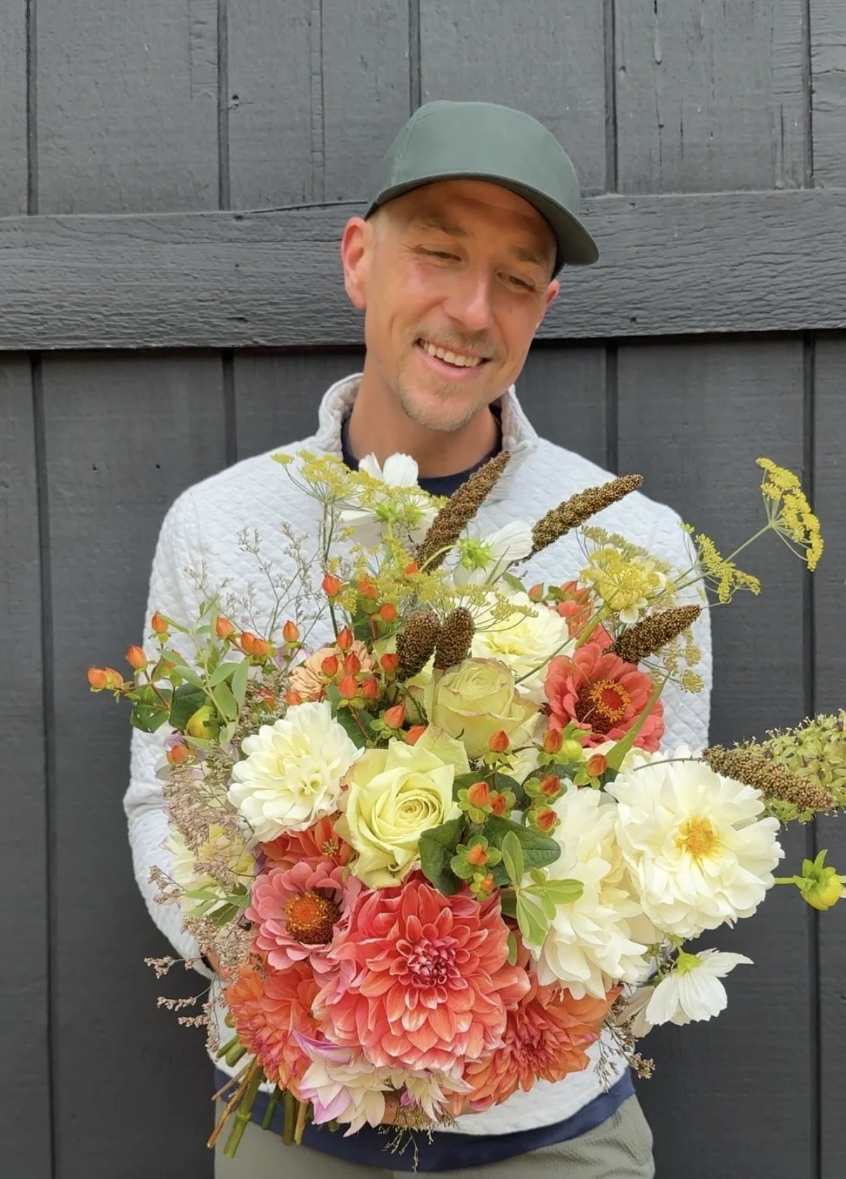 Michael Martin holding autumnal floral bouquet