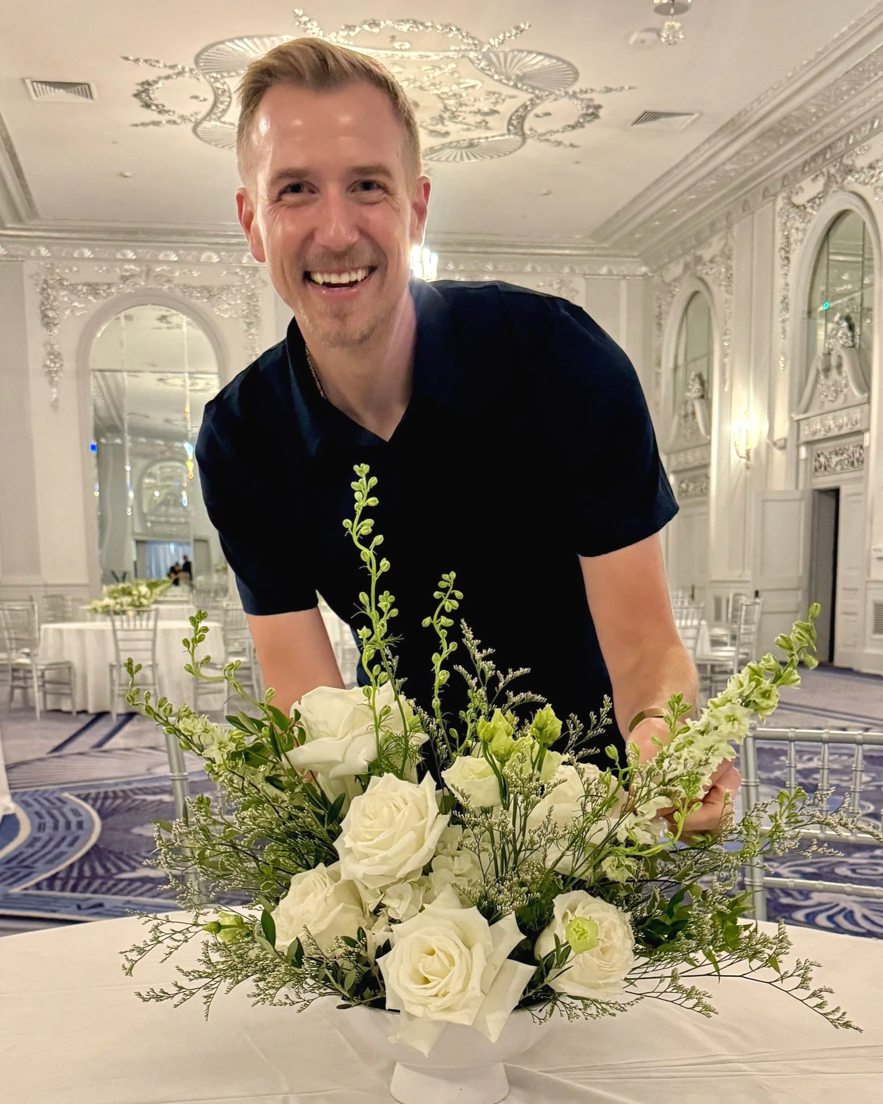 Michael Martin with floral centerpiece