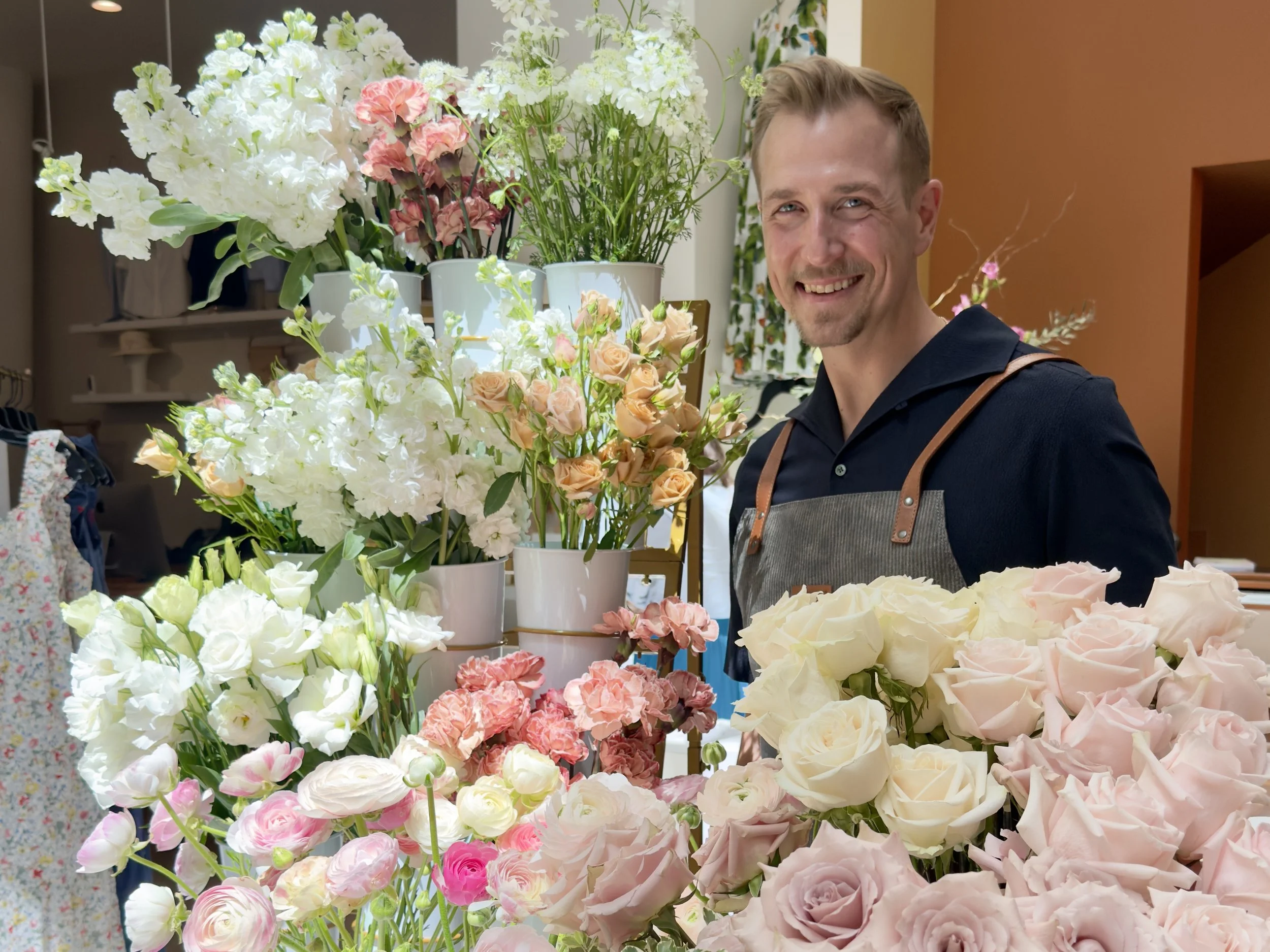 Michael Martin of Blossom Bar surrounded by fresh flowers for a floral workshop