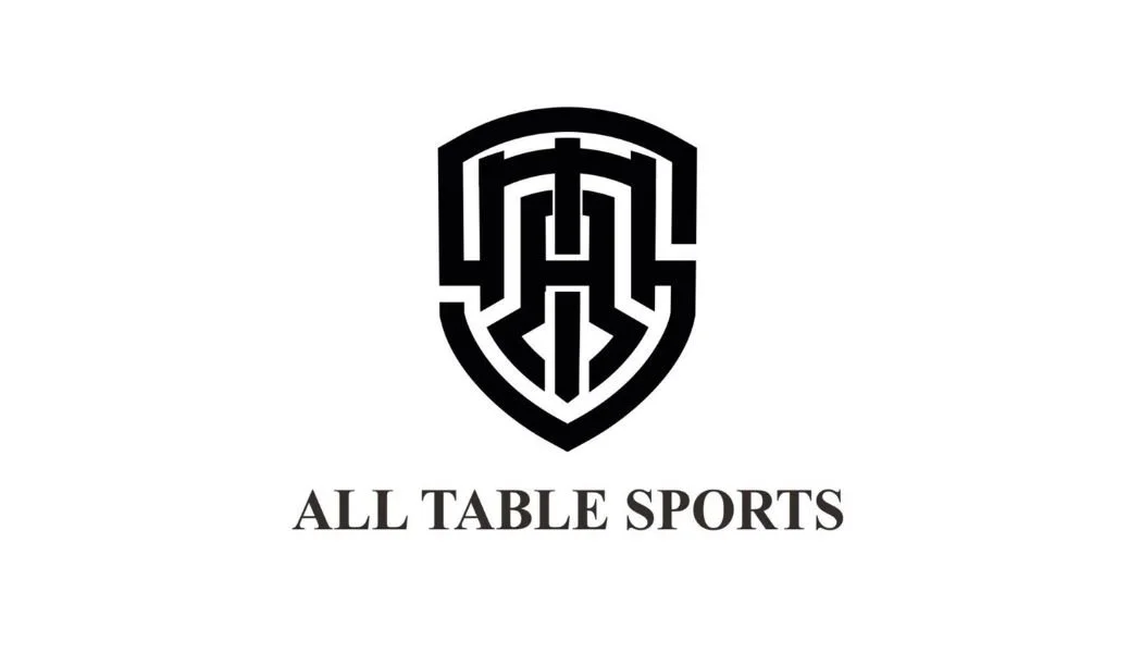 Black and white logo with a shield design and the words All Table Sports underneath.