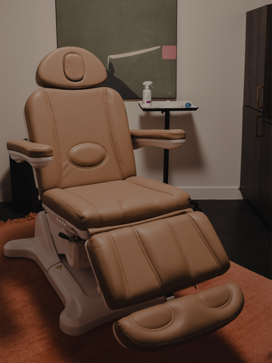 Treatment chair in a warmly lit treatment room