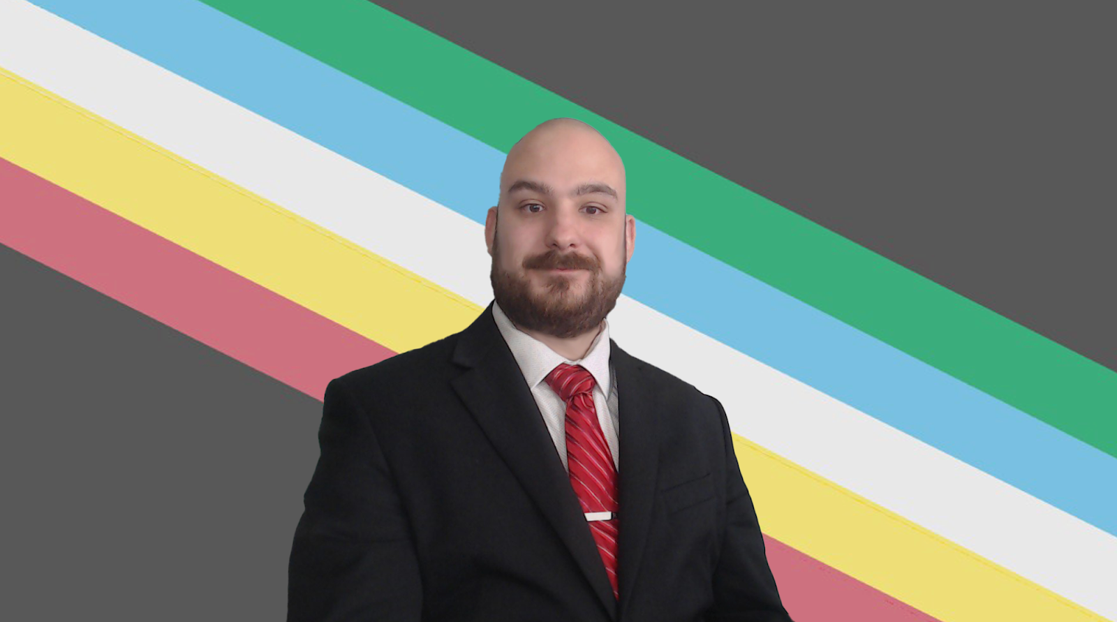 Man wearing a suit in front of a striped background