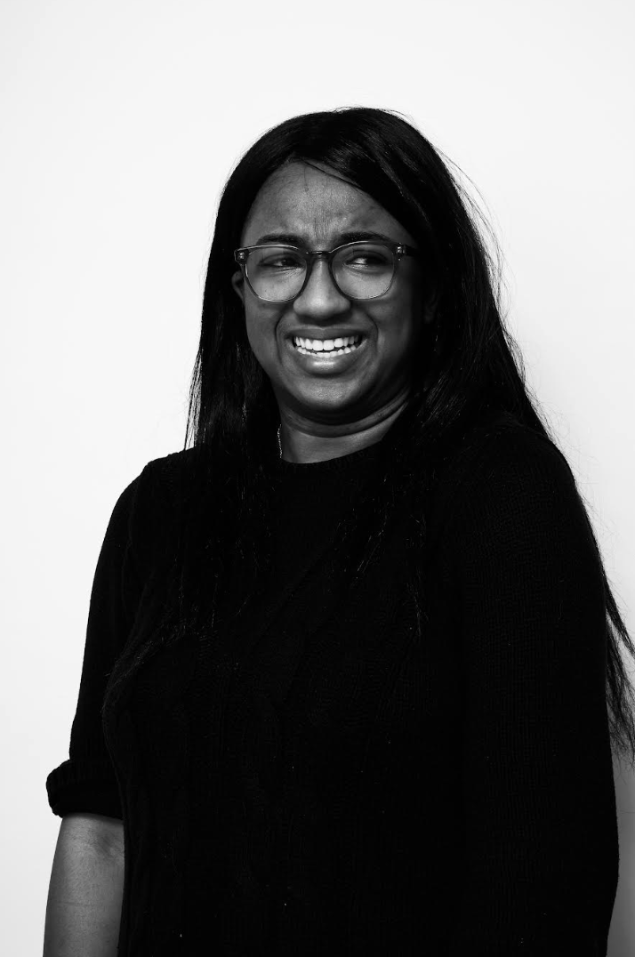 Black and white photo of a person smiling