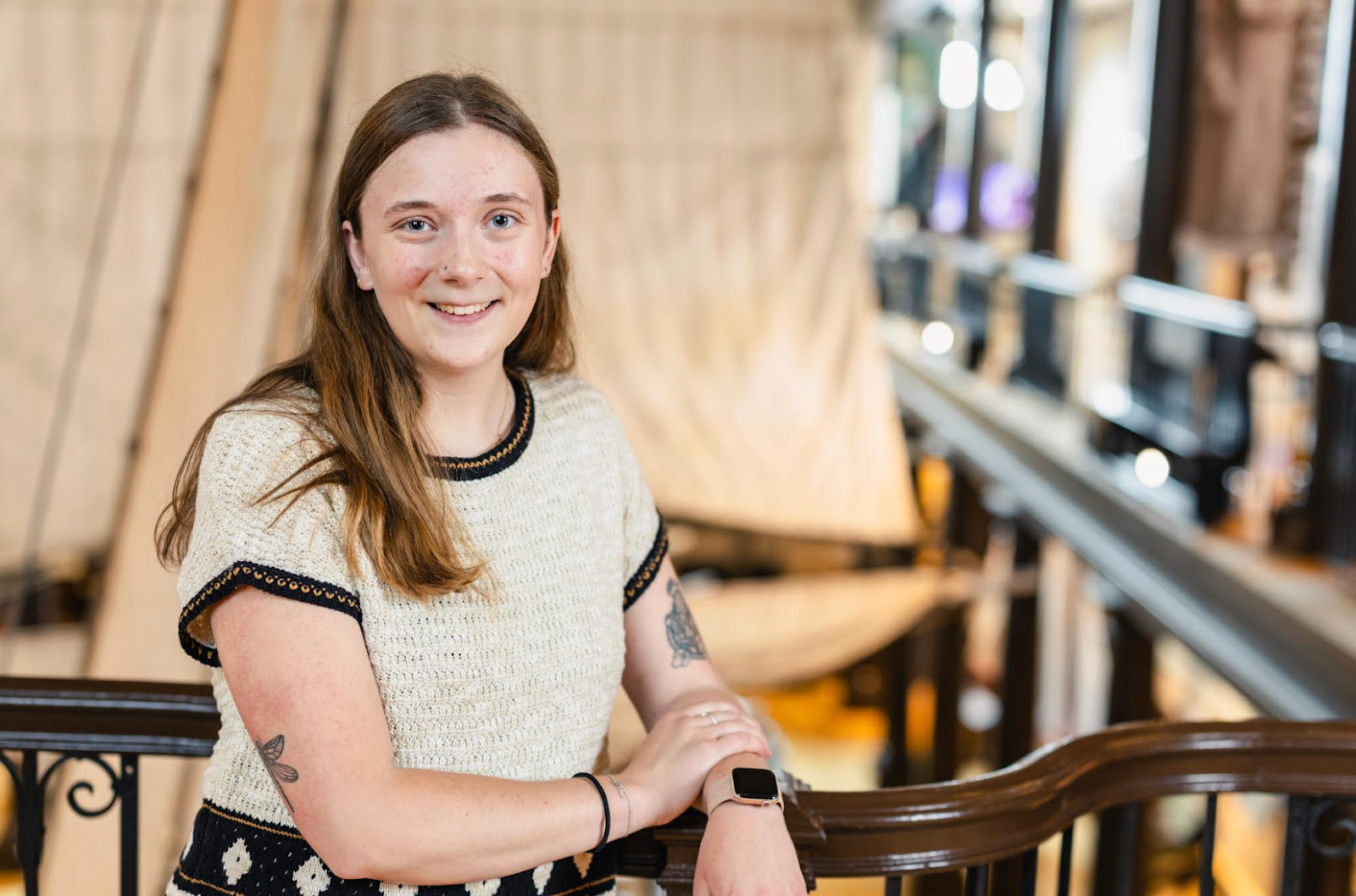 Person wearing white crocheted top.