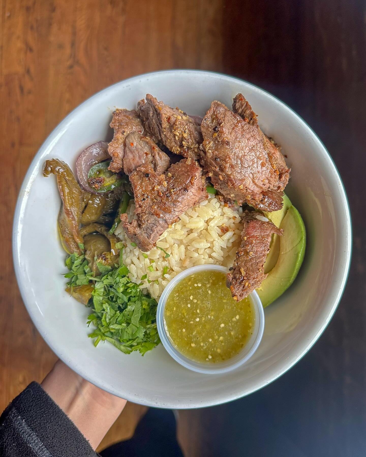 Spicing up our specials through Saturday: Our flank steak rice bowl &mdash; loaded with grilled flank steak, rice, saut&eacute;ed peppers &amp; onions, jalape&ntilde;os, avocado, fresh cilantro and our house-made salsa verde 🥩🔥 Oh and it&rsquo;s gl