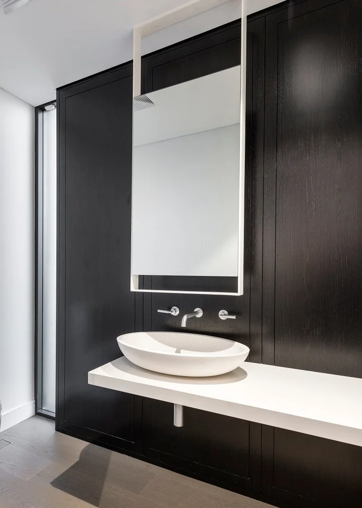 Dark timber feature wall with vessel basin and floating bench — modern bathroom renovation Perth