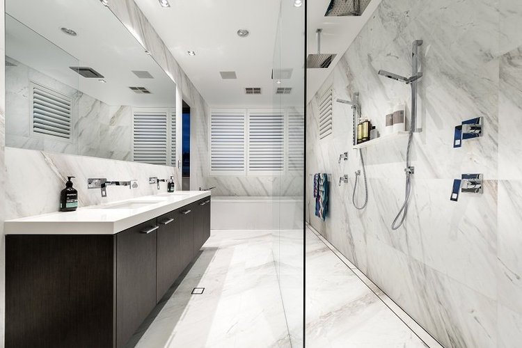 Full marble luxury bathroom with double vanity and large walk-in shower — bathroom renovation Perth