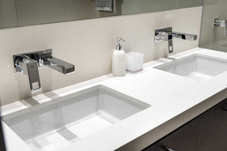 Double undermount basins with chrome wall-mounted taps — ensuite renovation Perth