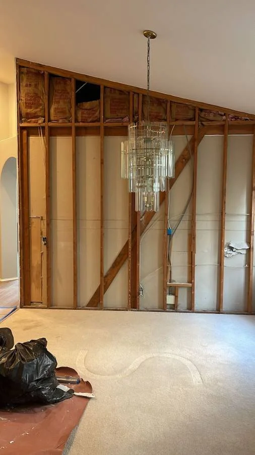Living room wall framing and insulation during a home renovation by AC Remodeling in San Diego..jpg