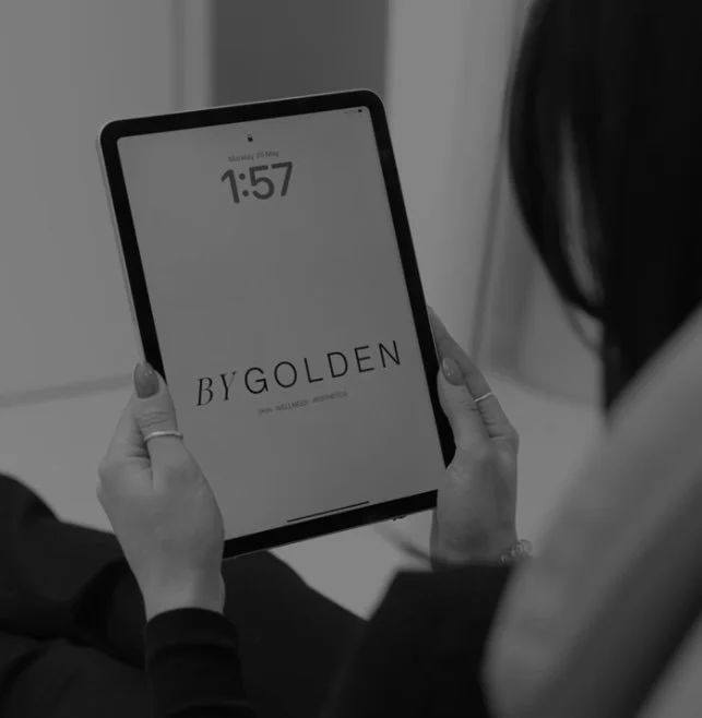 Cosmetic medicine consultation at BYGOLDEN Parkdale, with 3D facial imaging on a tablet