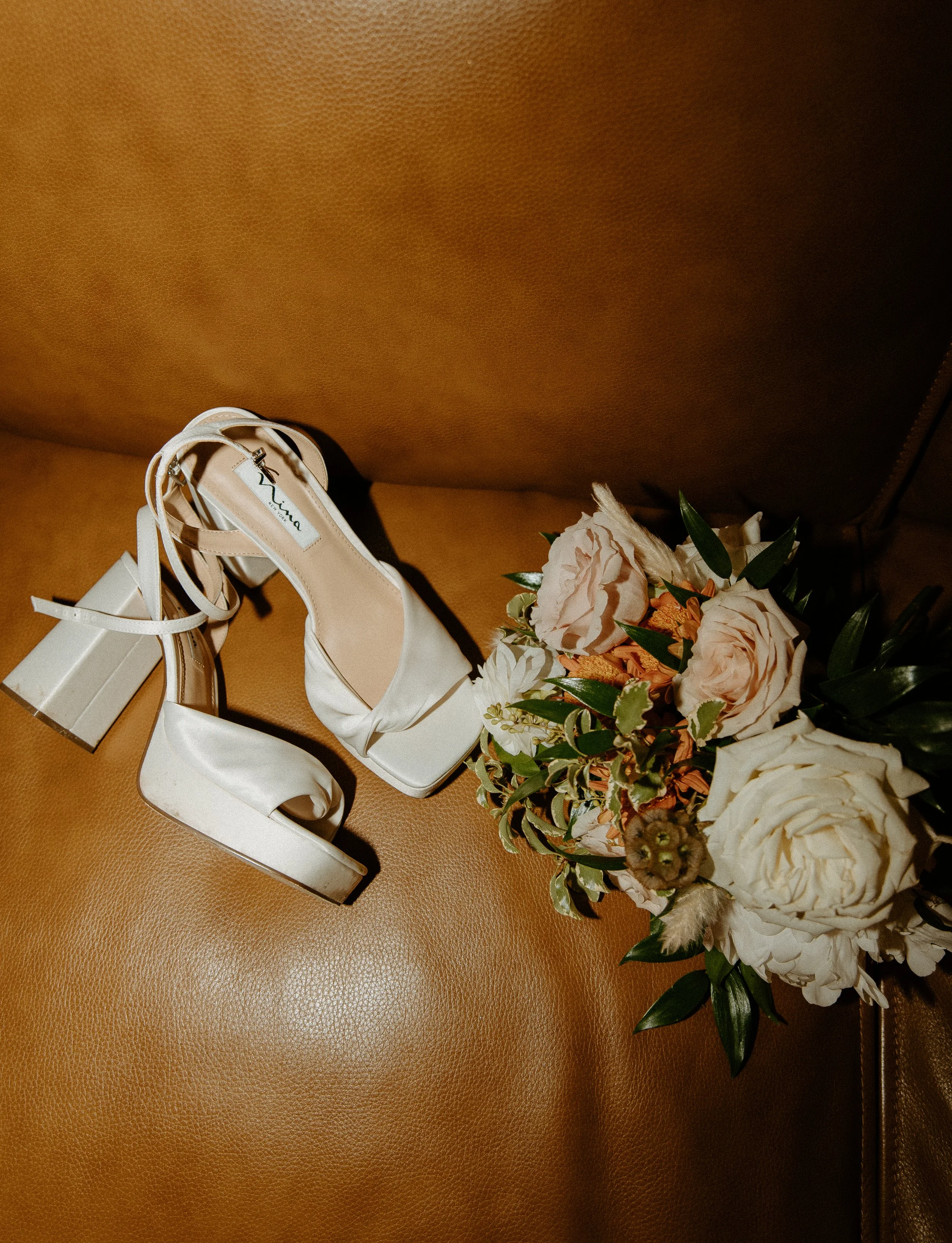 bridal shoes and bouquet wedding detail photo