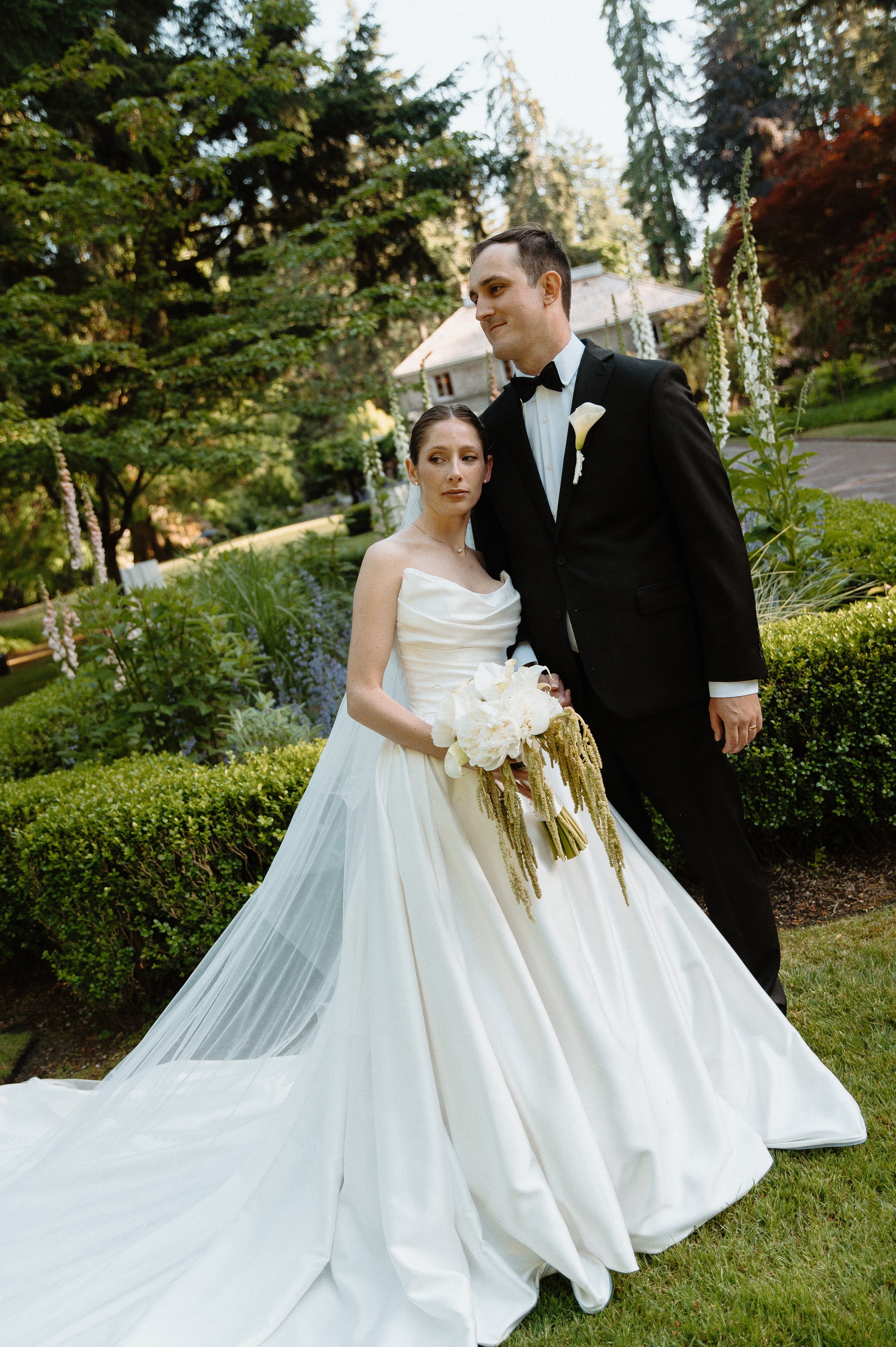 Romantic black and white portrait of a bride and groom in the gardens at Lakewold Gardens wedding venue.