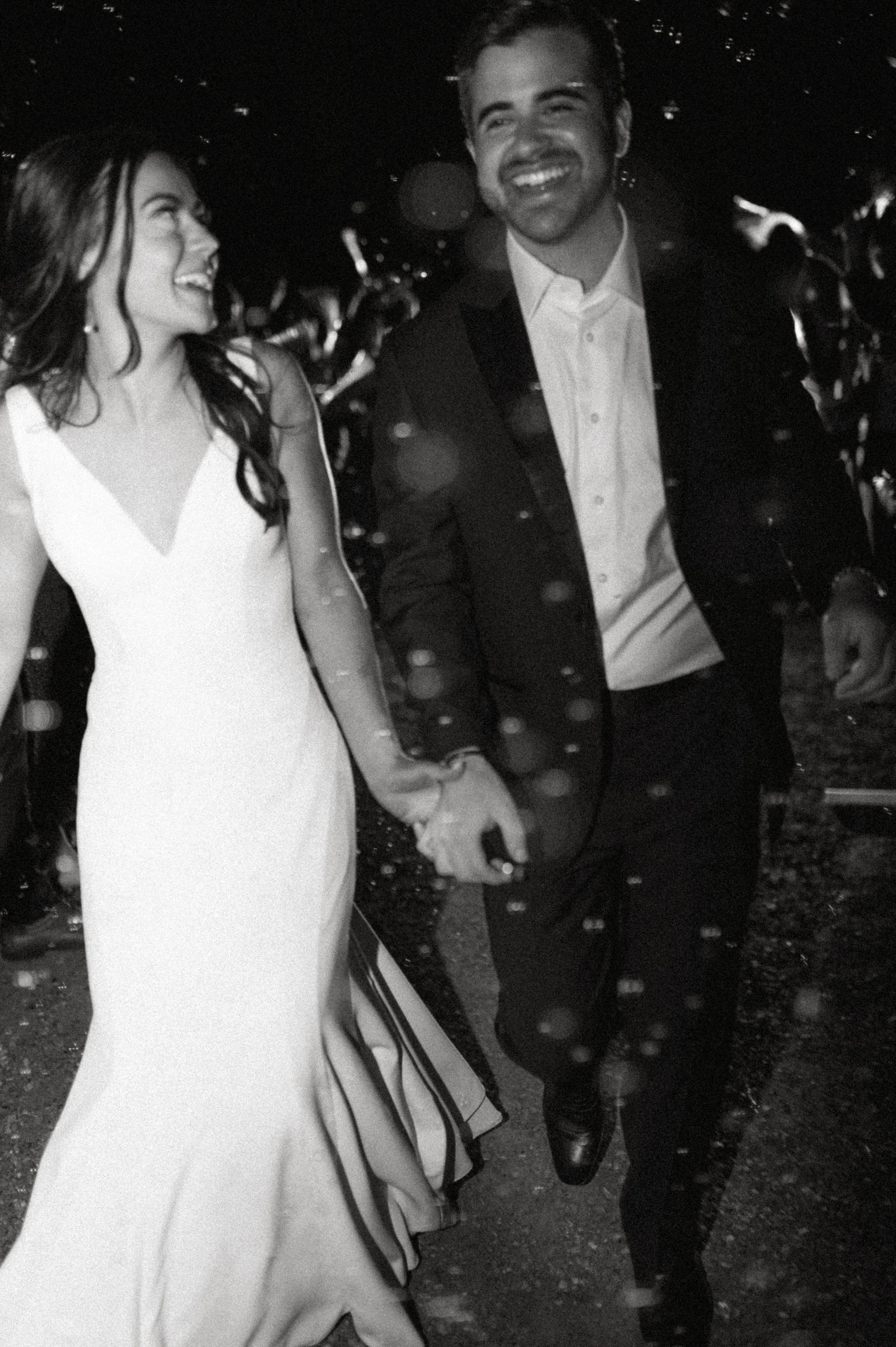 Bride and groom walking through a bubble exit at night + wedding reception send-off + Liljebeck Farms wedding + Woodinville wedding