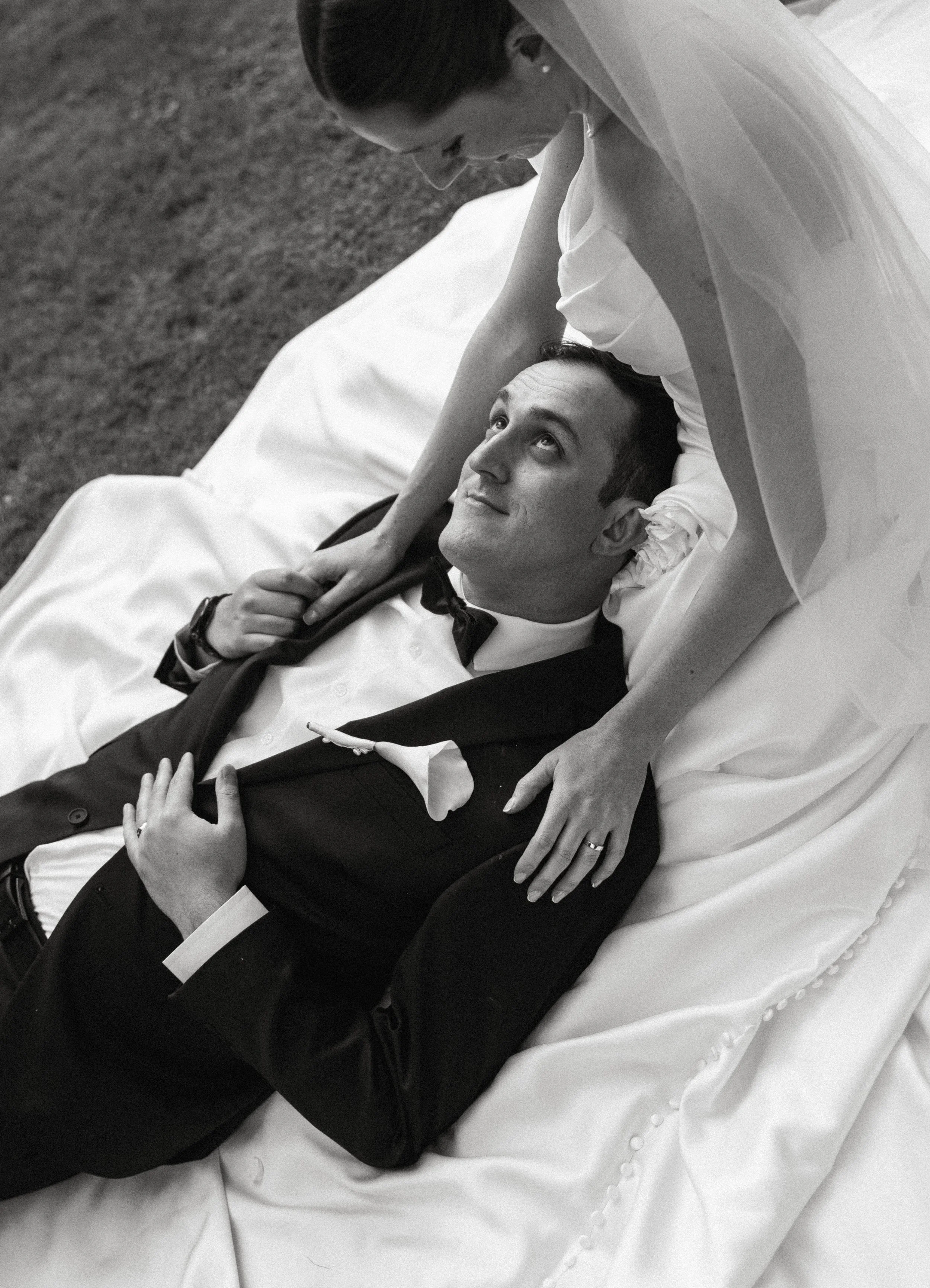 Romantic black and white portrait of a bride and groom in the gardens at Lakewold Gardens wedding venue.