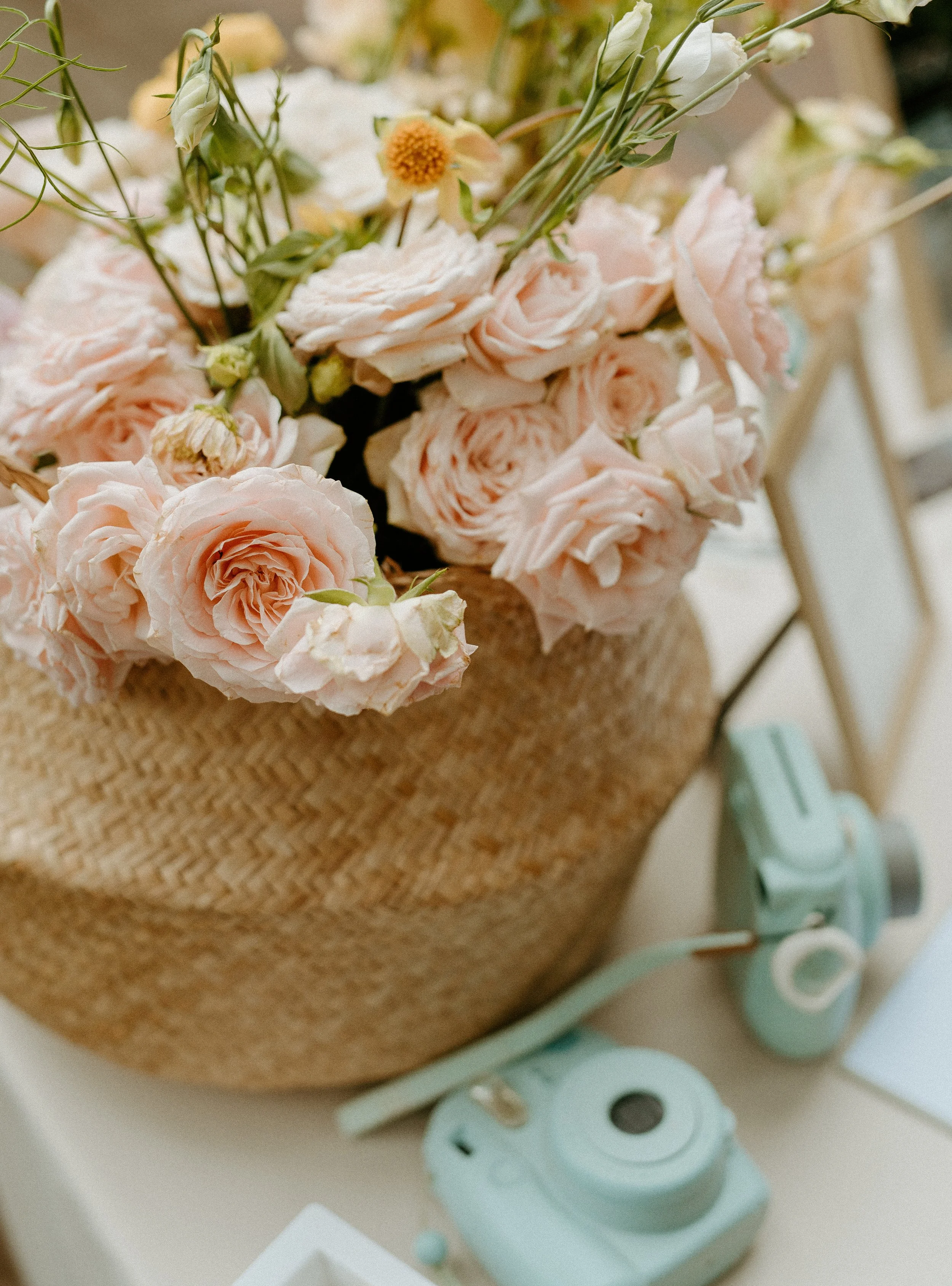 Romantic wedding centerpiece with blush roses in woven basket + wedding decor inspiration + Washington wedding + PNW wedding photographer