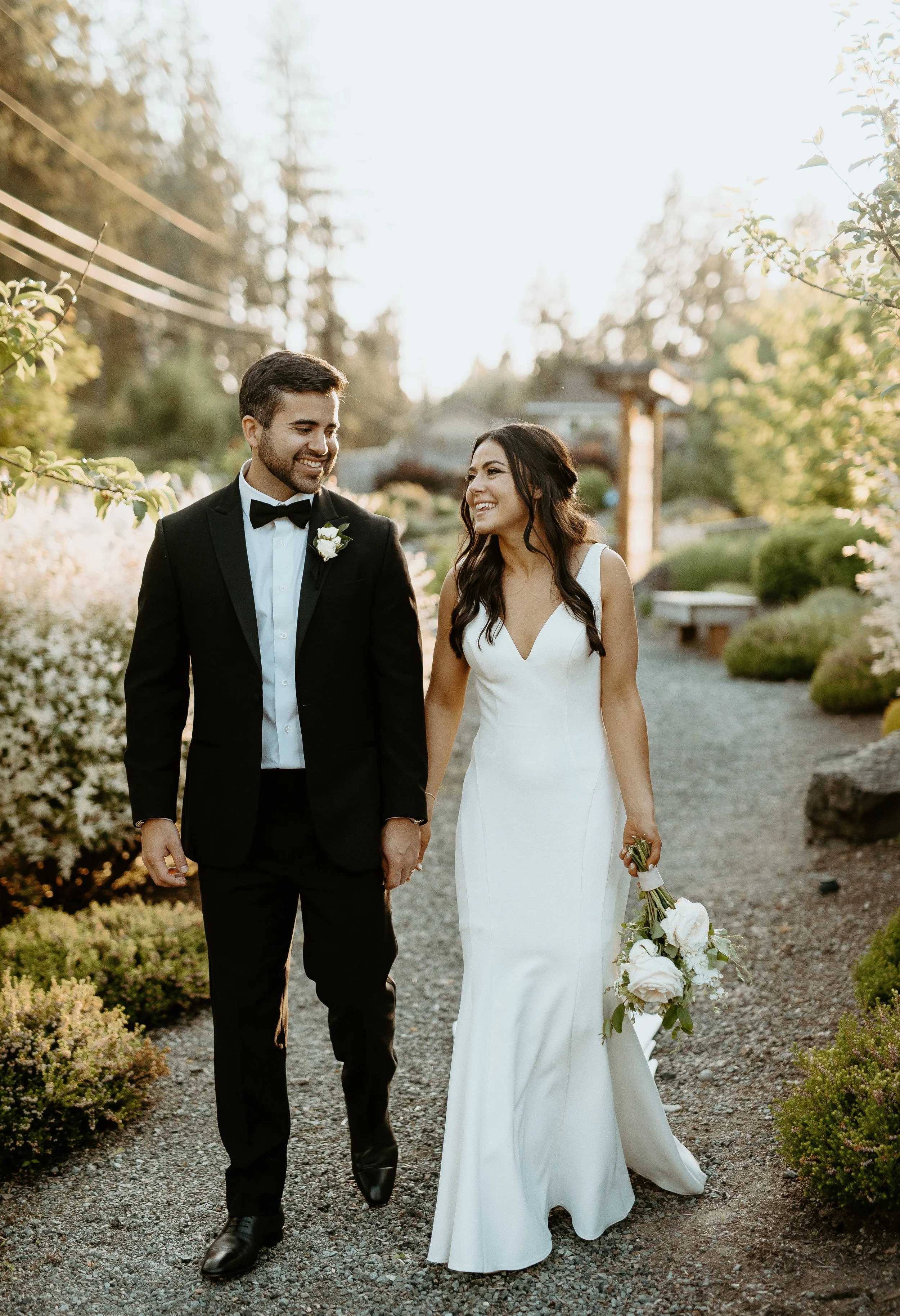 Bride and groom walking hand-in-hand during golden hour + sunset wedding portraits + Woodinville wedding + Washington wedding photography