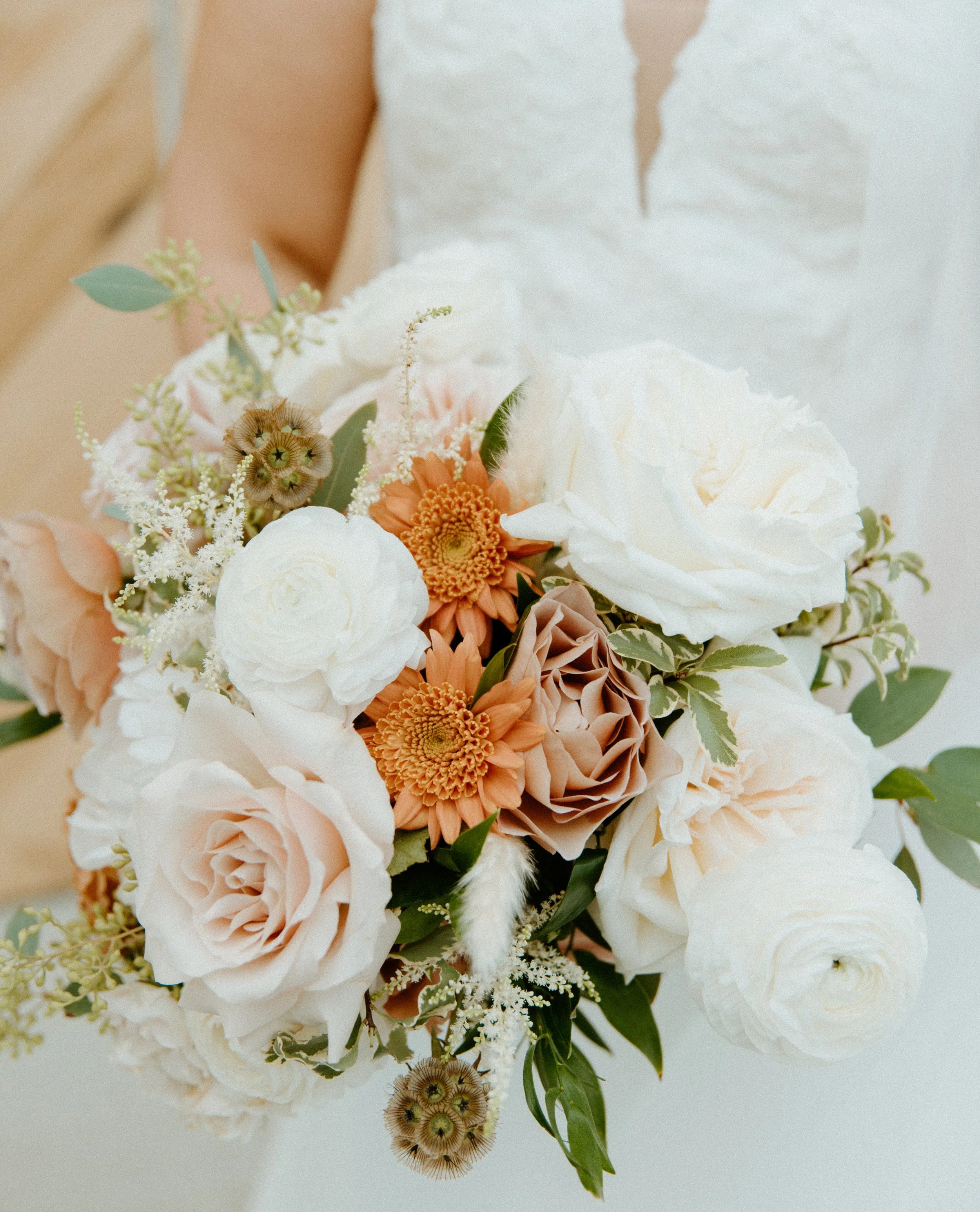 bride holding bouquet soft romantic wedding portrait