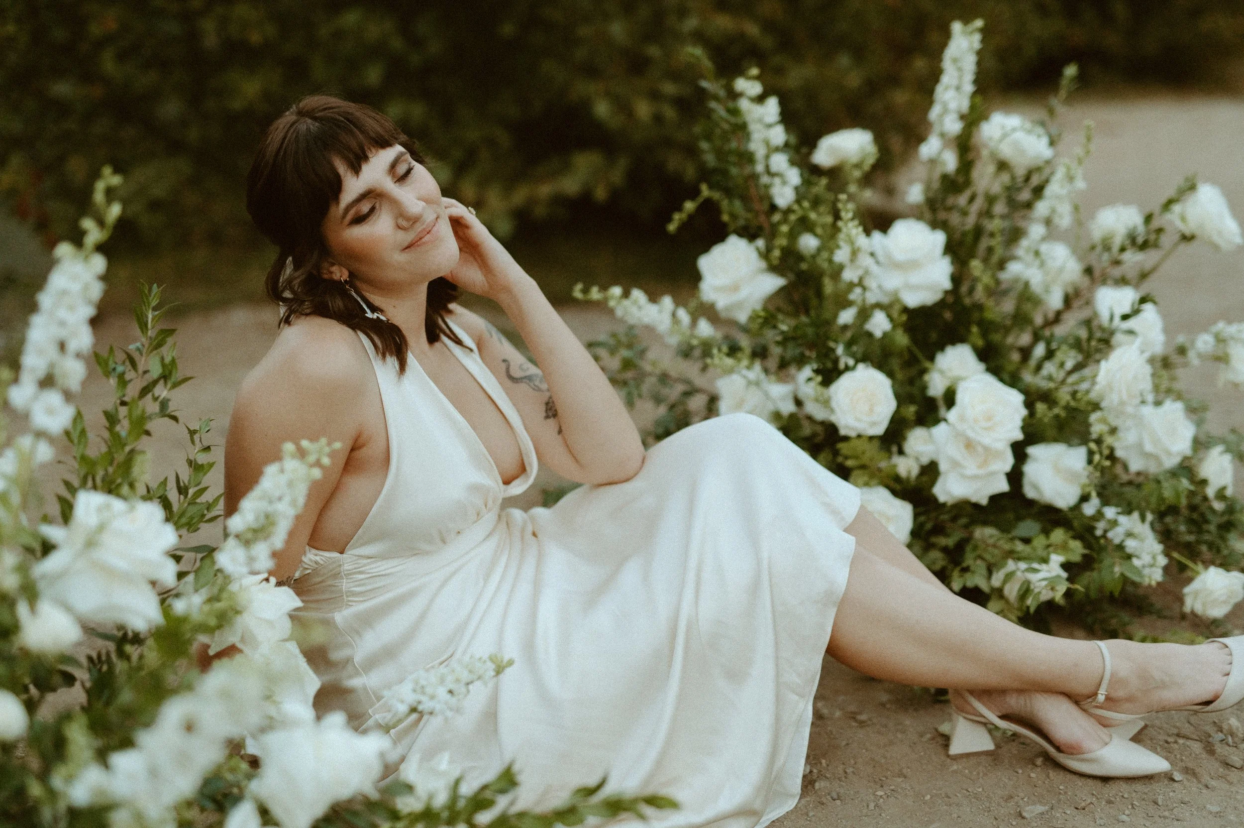 bride portrait sitting in white dress with florals + Snoqualmie Pass elopement inspiration + PNW wedding photographer details