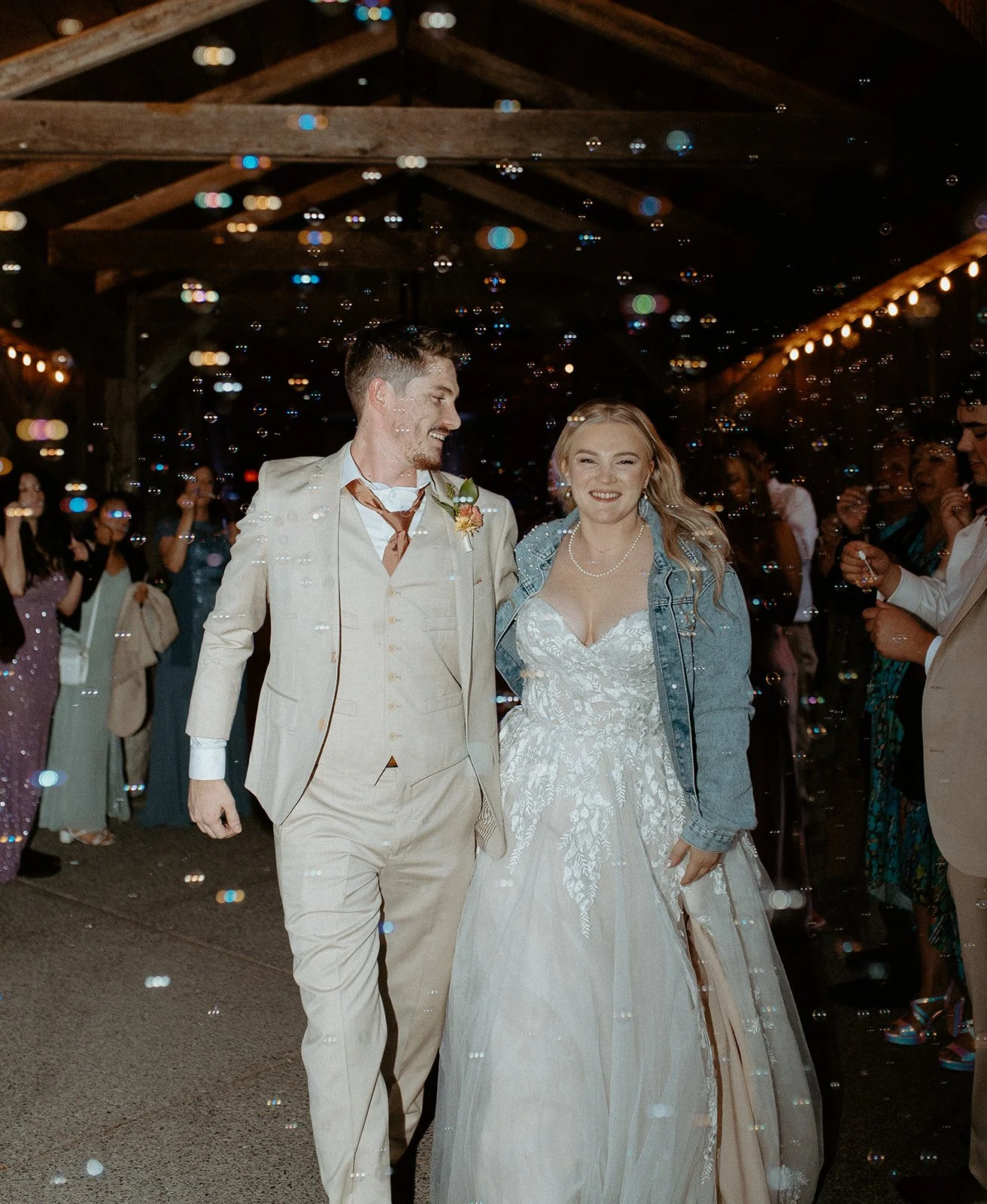 Bride and groom bubble exit at Kelley Farm wedding in Buckley Washington at night