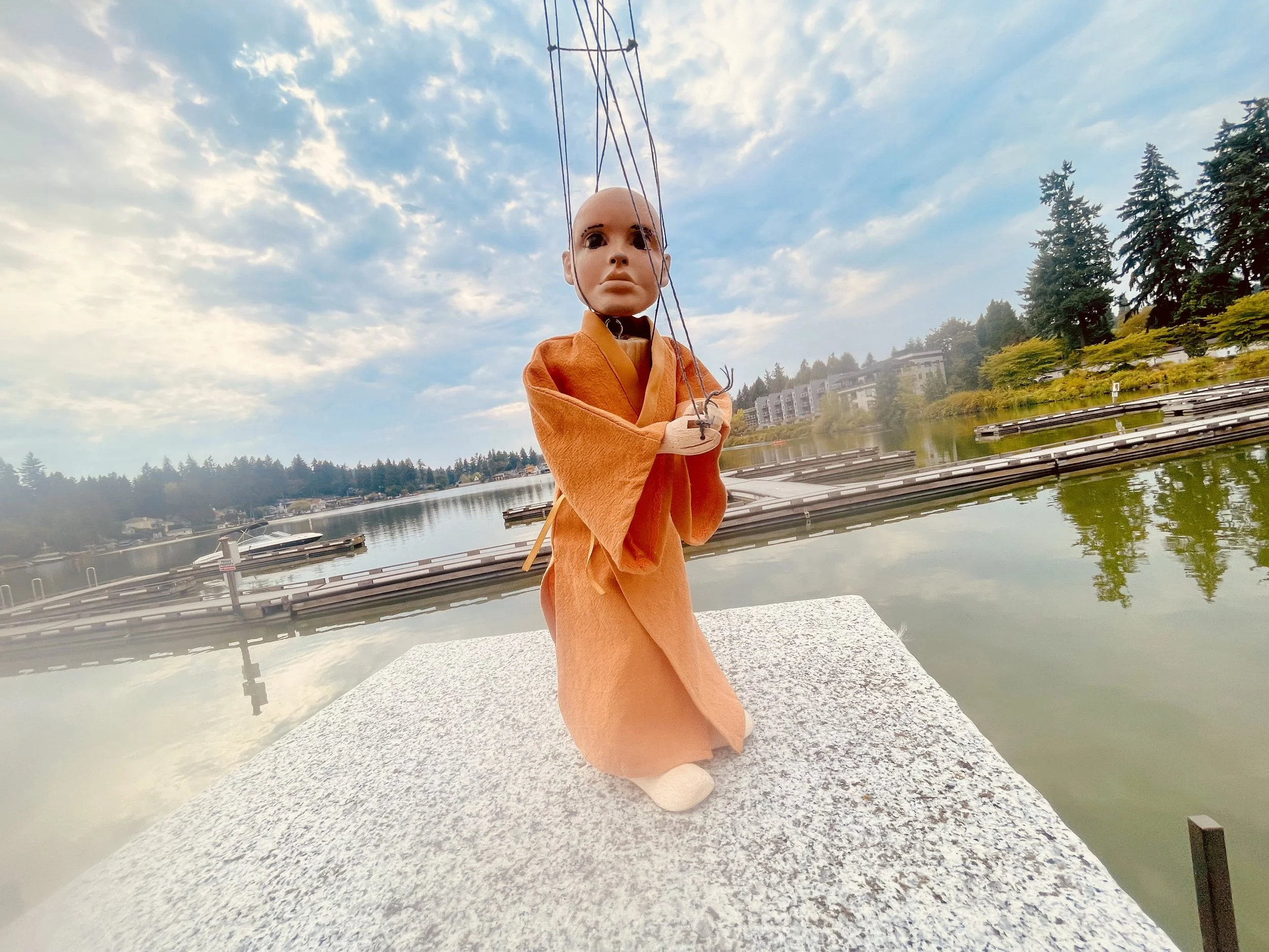 I offer this puppet humbly and with respect. This is Namaste. She is a little monk. She has sitting and walking meditation positions. She enjoys Dharma, meditation, farming, music, and yoga. Namaste has a humble and deep bow. 
