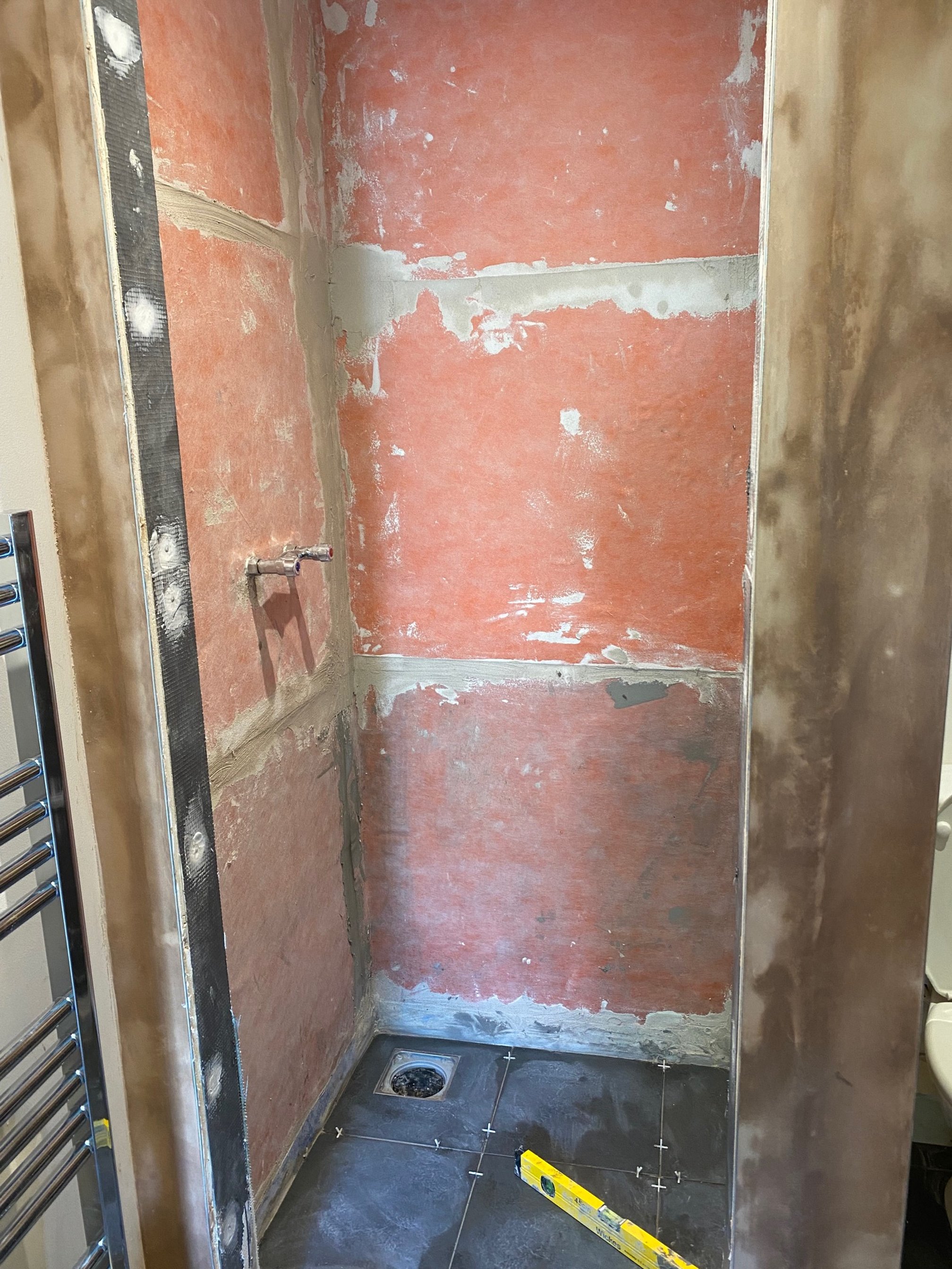 tiled shelf shelving niche bath en-suite shower unit enclosure vanity units white kitchen island renovation plastering flooring electrical tiling metro modern stylish breakfast bar remodel design contractor rewire installer tradesman builder home imp