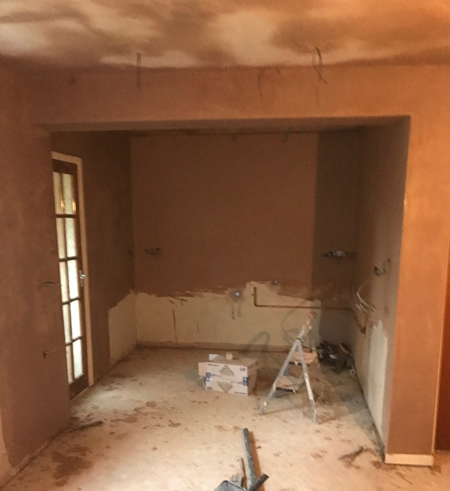 white kitchen island renovation plastering flooring electrical tiling metro modern stylish breakfast bar remodel design contractor rewire installer tradesman builder home improvement floor leveling worktop bespoke carpentry plumbing layout planning p