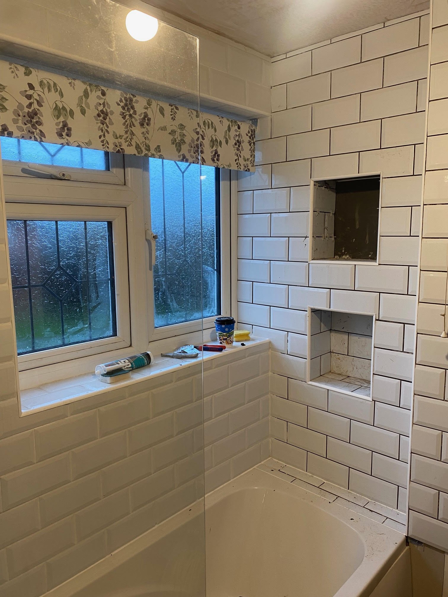 tiled shelf shelving niche bath en-suite shower unit enclosure vanity units white kitchen island renovation plastering flooring electrical tiling metro modern stylish breakfast bar remodel design contractor rewire installer tradesman builder home imp