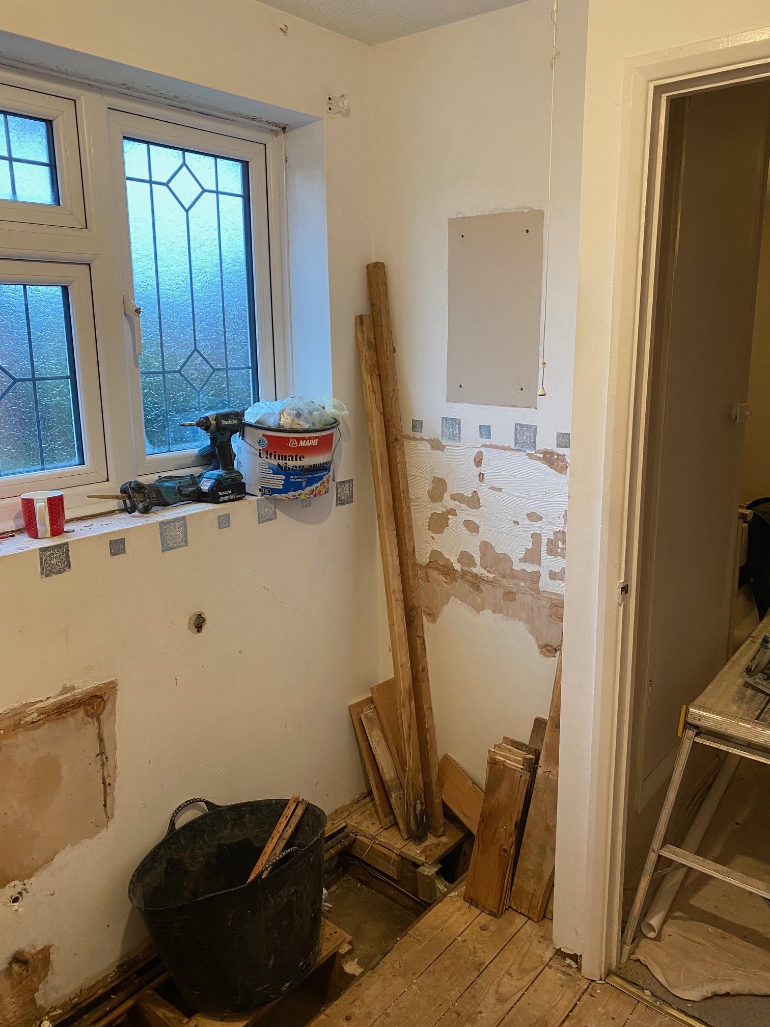 tiled shelf shelving niche bath en-suite shower unit enclosure vanity units white kitchen island renovation plastering flooring electrical tiling metro modern stylish breakfast bar remodel design contractor rewire installer tradesman builder home imp