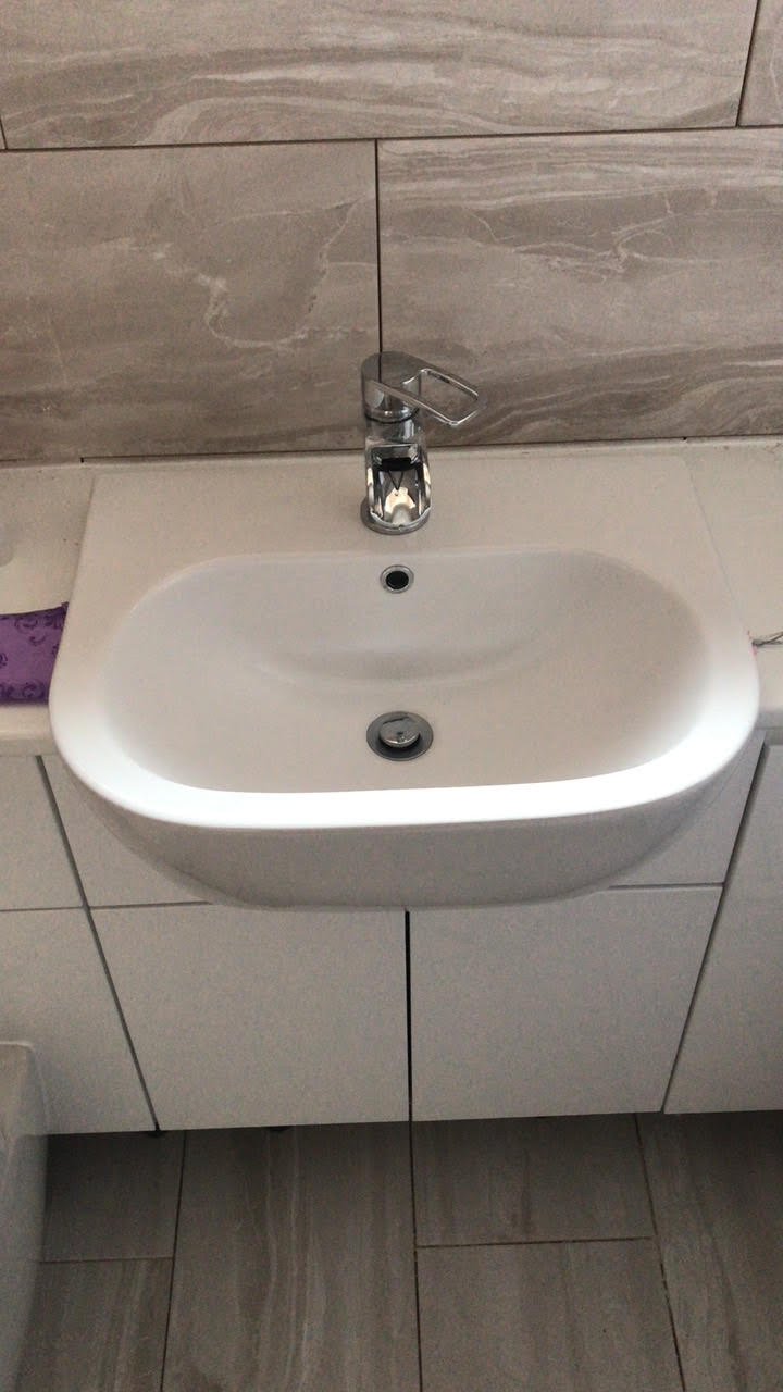 en-suite shower unit enclosure vanity units white kitchen island renovation plastering flooring electrical tiling metro modern stylish breakfast bar remodel design contractor rewire installer tradesman builder home improvement floor leveling worktop