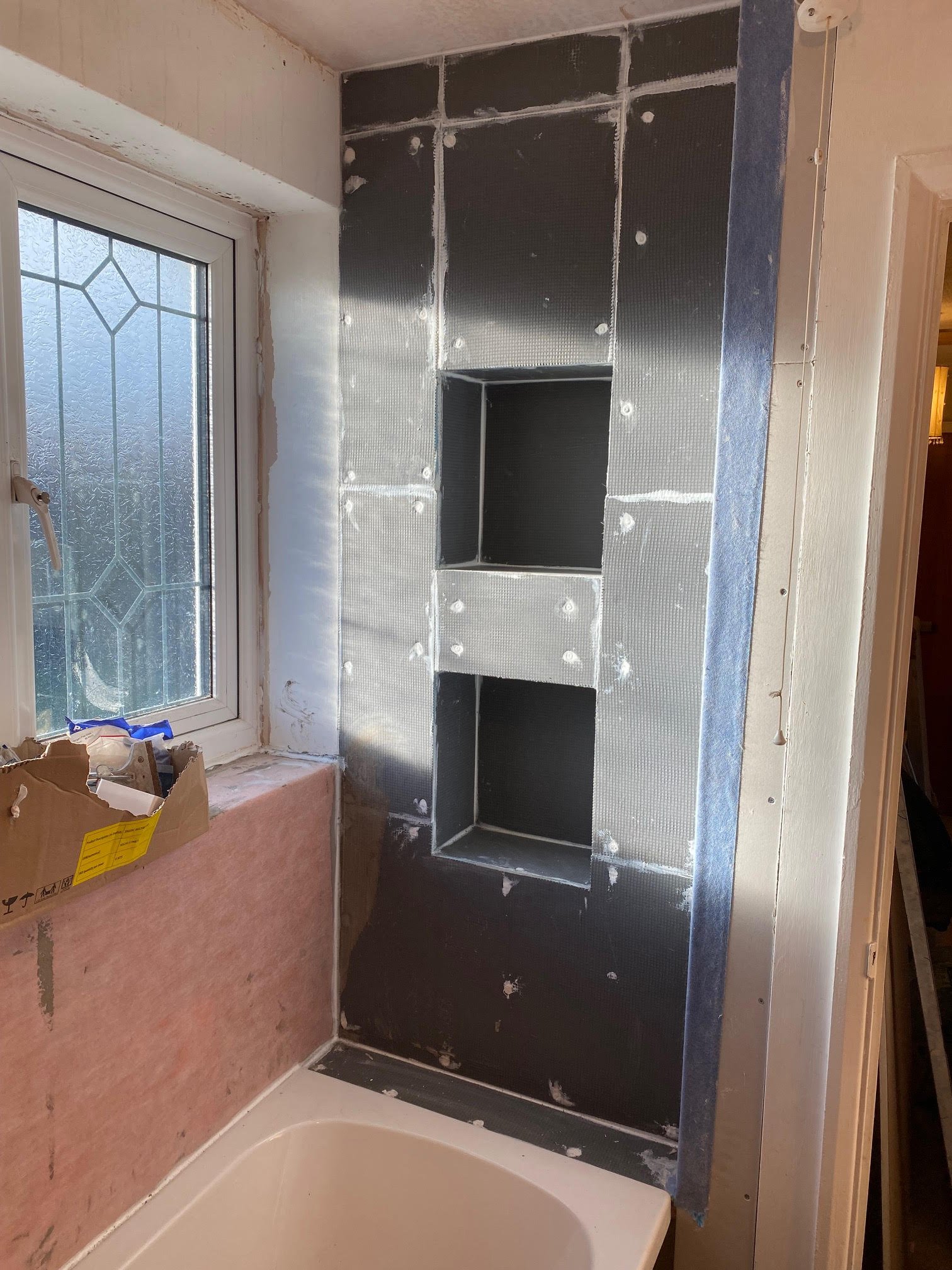 tiled shelf shelving niche bath en-suite shower unit enclosure vanity units white kitchen island renovation plastering flooring electrical tiling metro modern stylish breakfast bar remodel design contractor rewire installer tradesman builder home imp