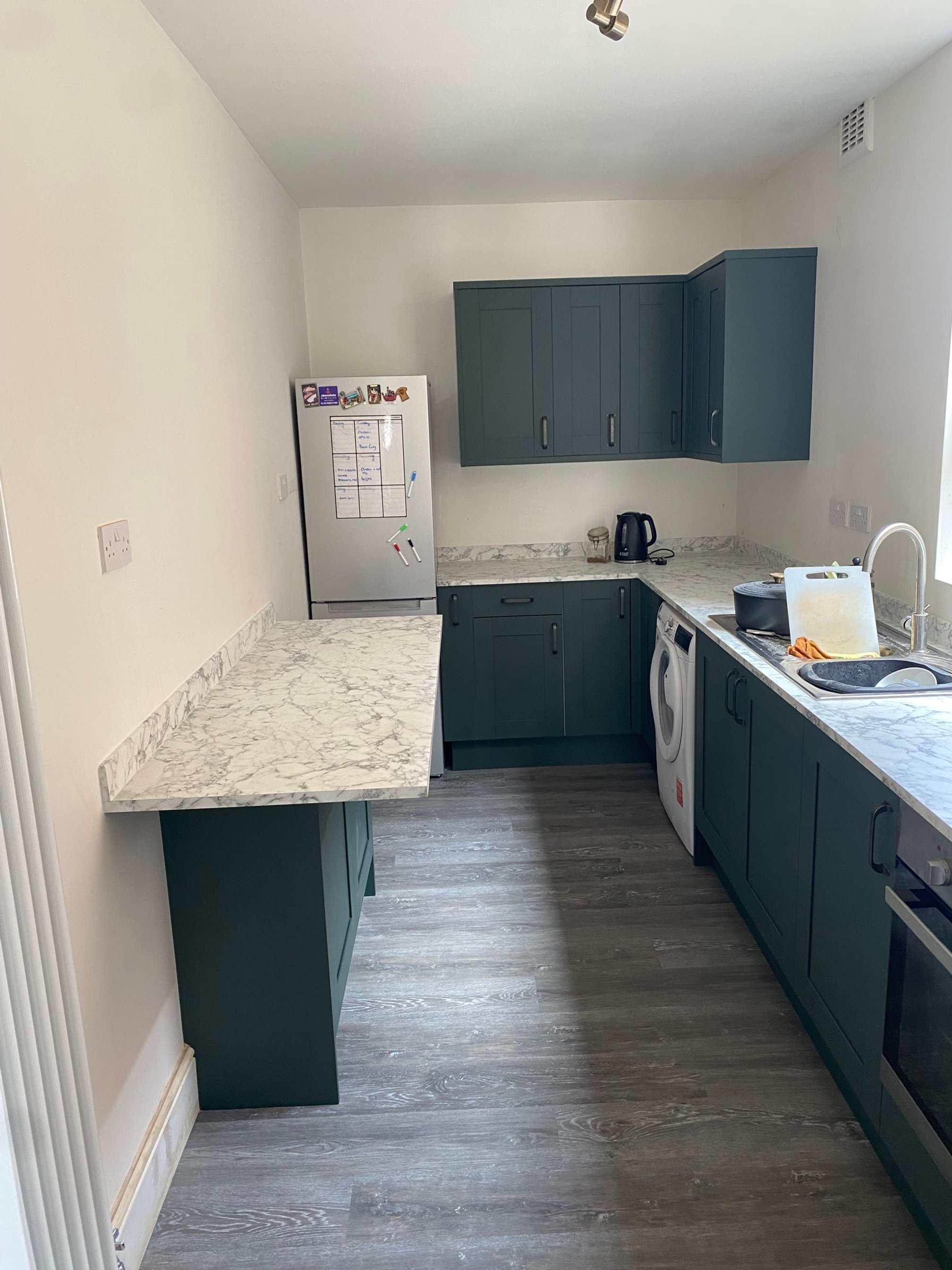 tiled shelf shelving niche bath en-suite shower unit enclosure vanity units white kitchen island renovation plastering flooring electrical tiling metro modern stylish breakfast bar remodel design contractor rewire installer tradesman builder home imp