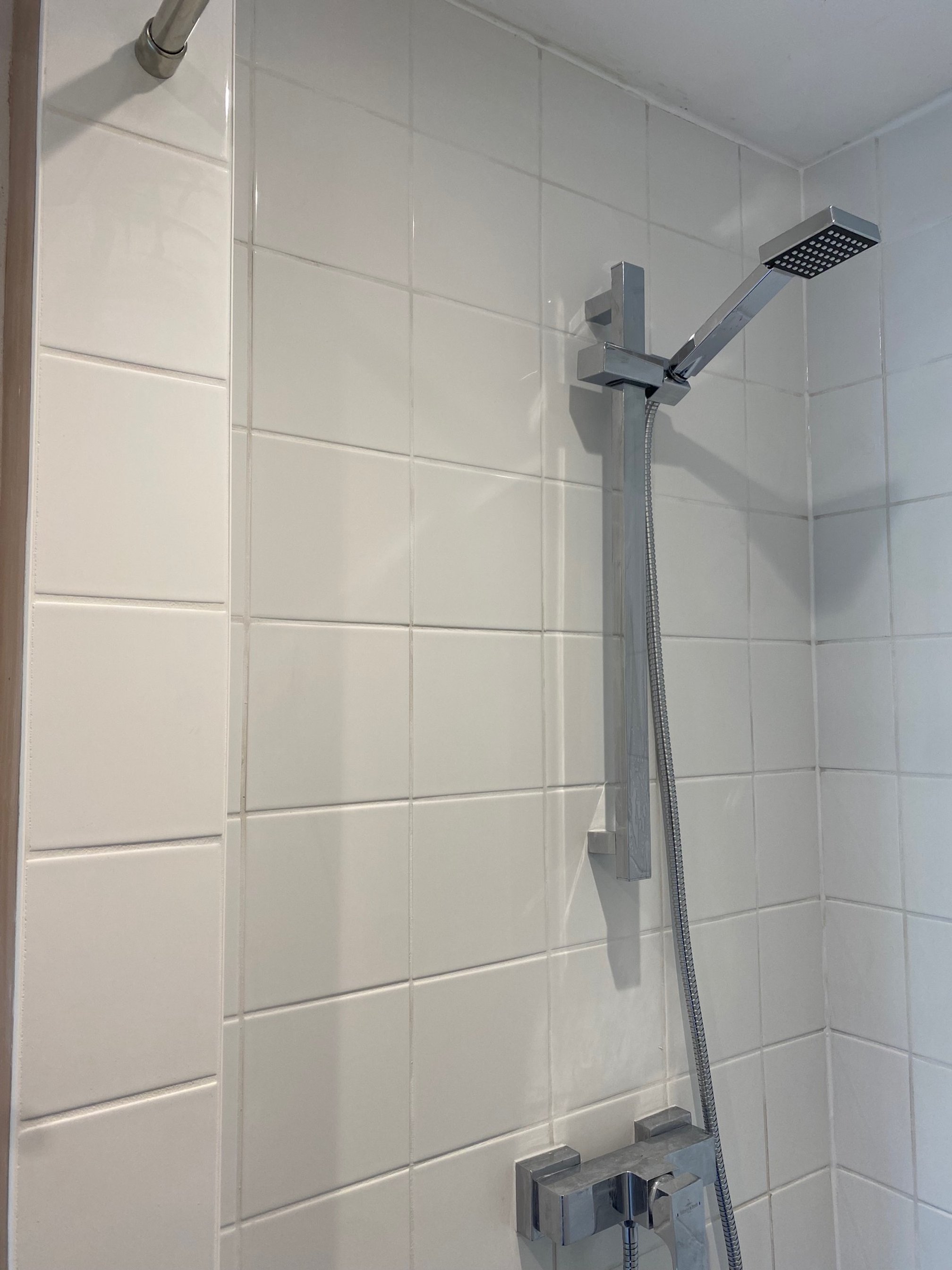 tiled shelf shelving niche bath en-suite shower unit enclosure vanity units white kitchen island renovation plastering flooring electrical tiling metro modern stylish breakfast bar remodel design contractor rewire installer tradesman builder home imp