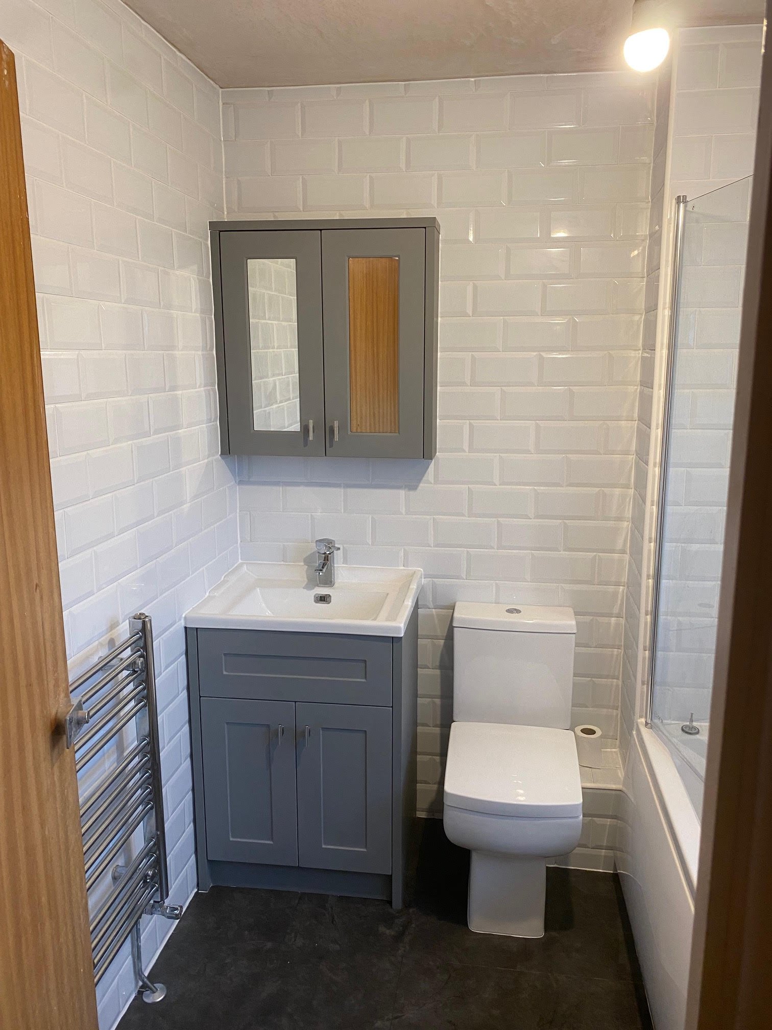 tiled shelf shelving niche bath en-suite shower unit enclosure vanity units white kitchen island renovation plastering flooring electrical tiling metro modern stylish breakfast bar remodel design contractor rewire installer tradesman builder home imp