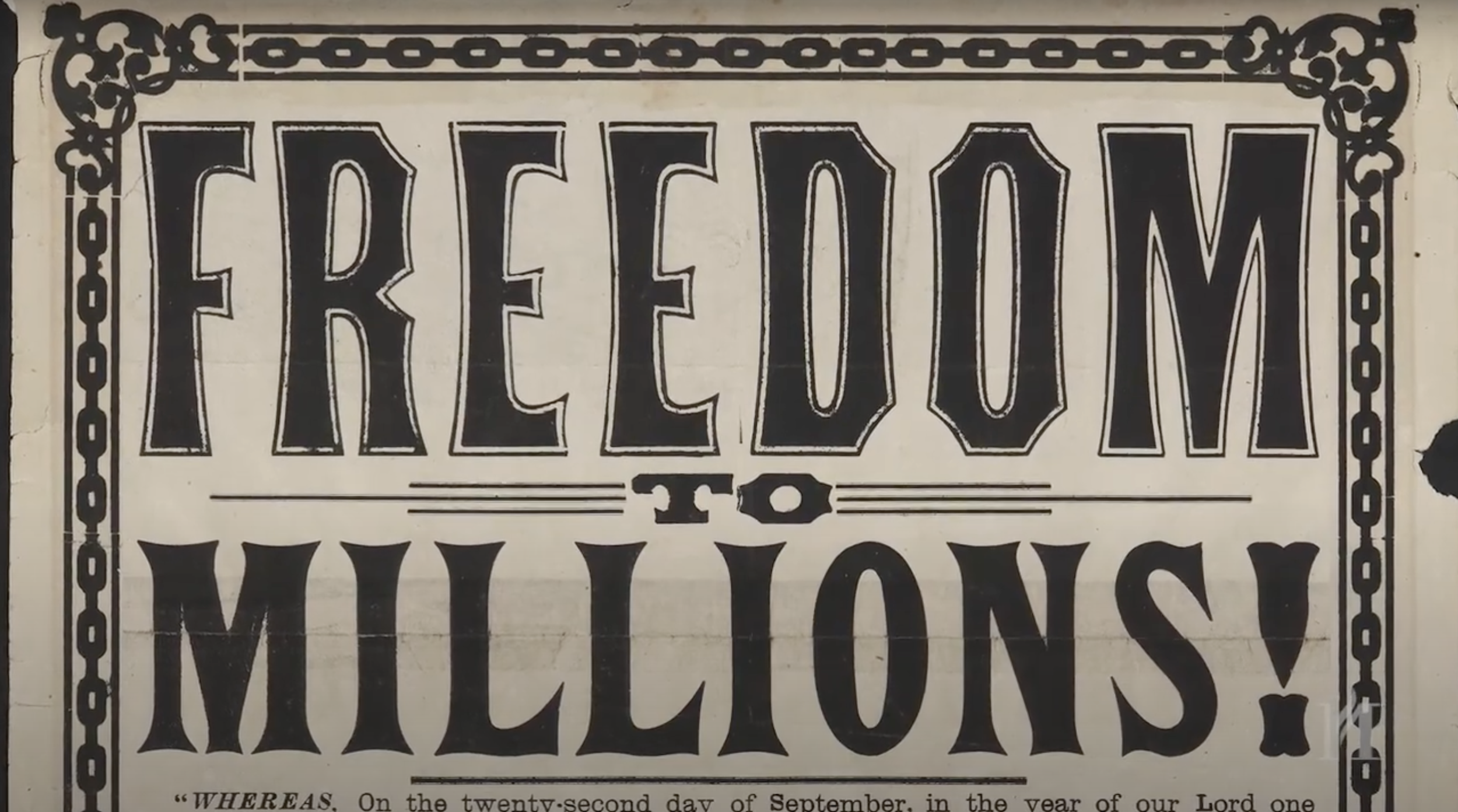 A black and white vintage sign reading 'Freedom to Millions!' with decorative border and stylized lettering.