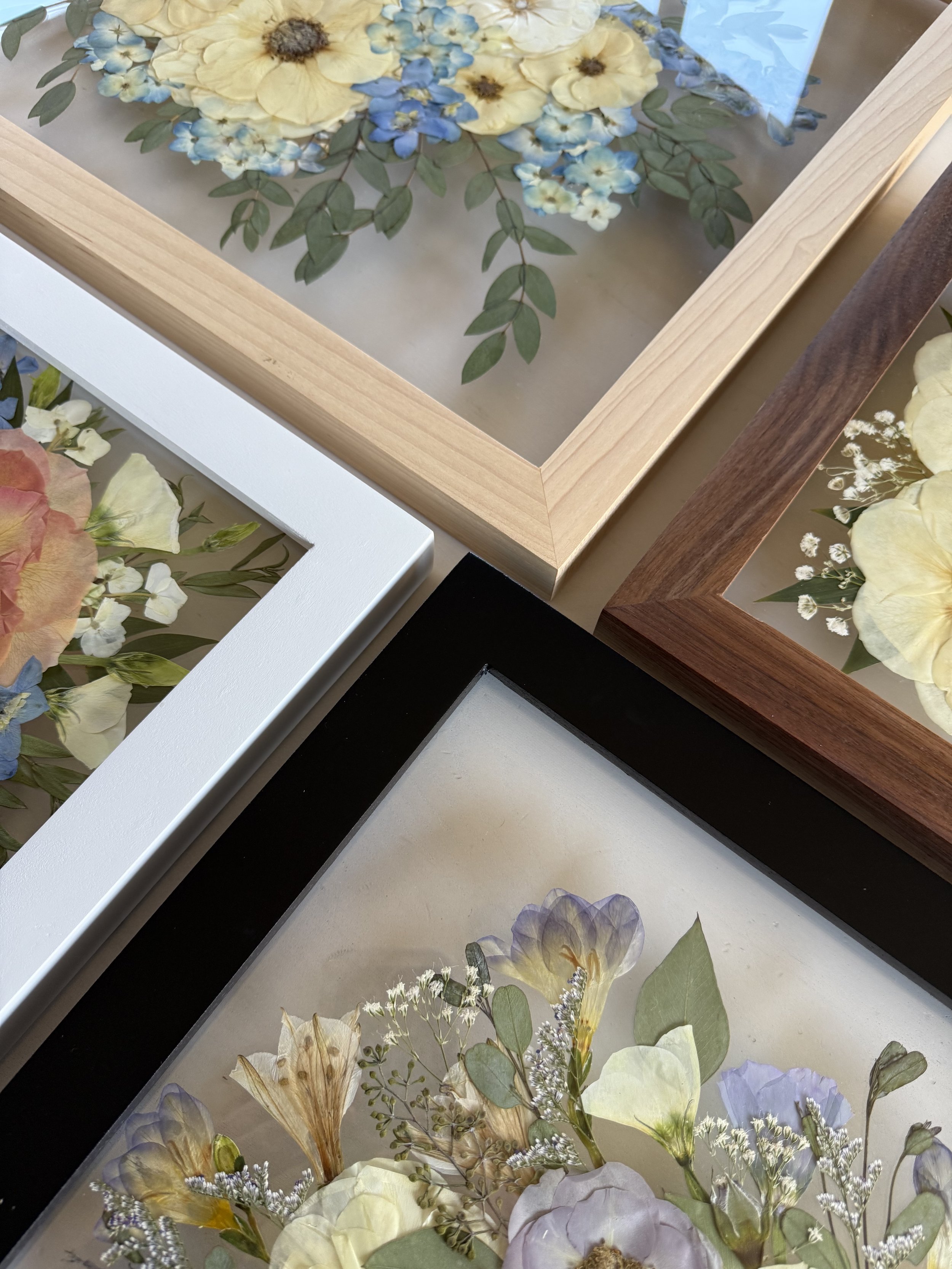 Framed bridal and memorial flowers in hardwood frames made in Michigan.