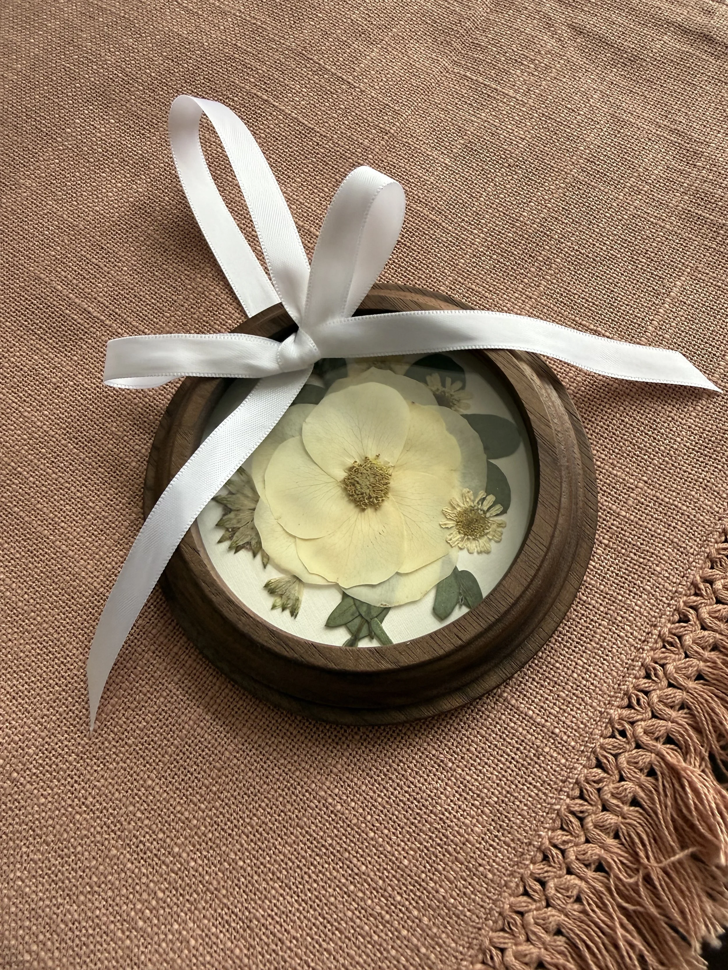 Wood pressed flower ornament.