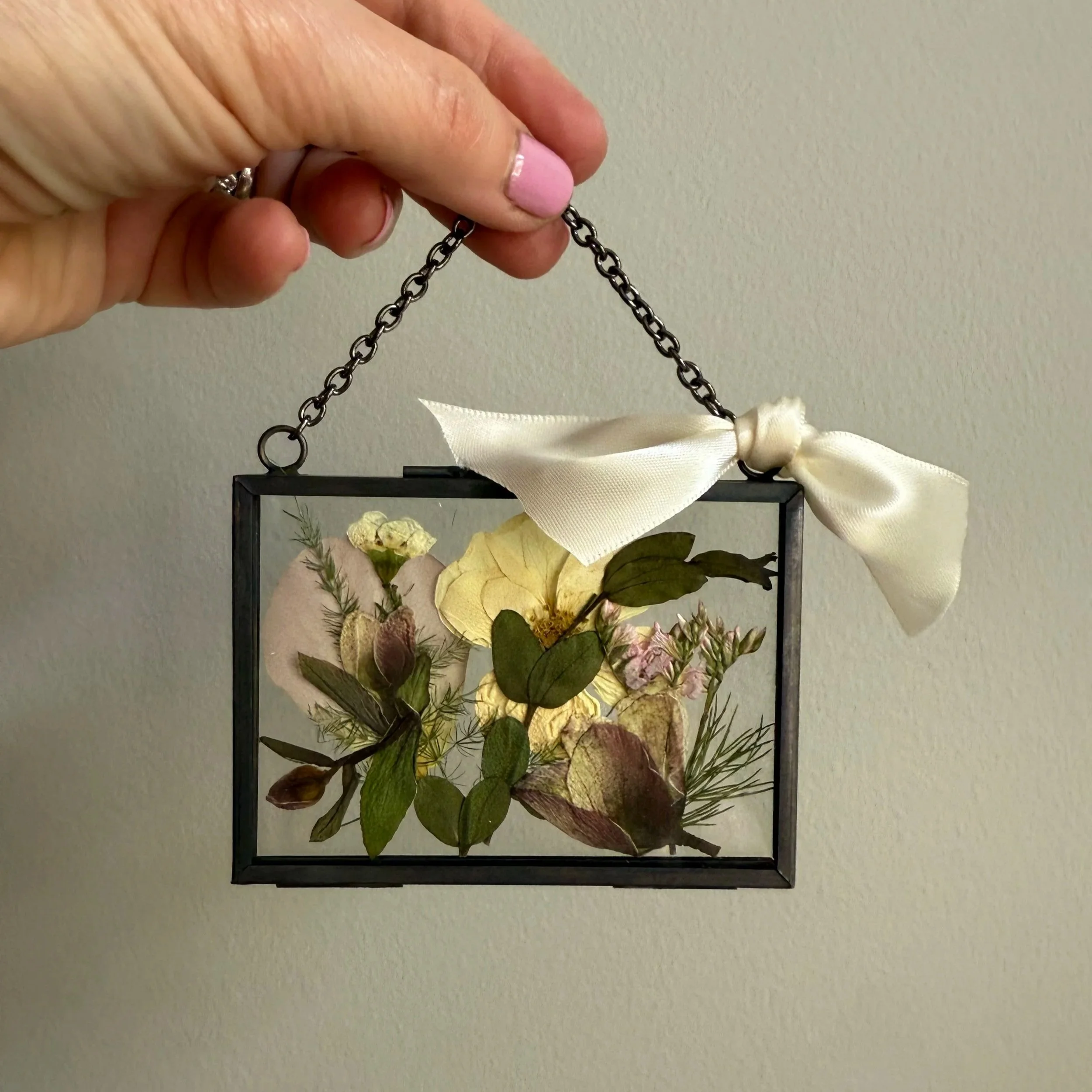 Pressed flower bridal ornament.