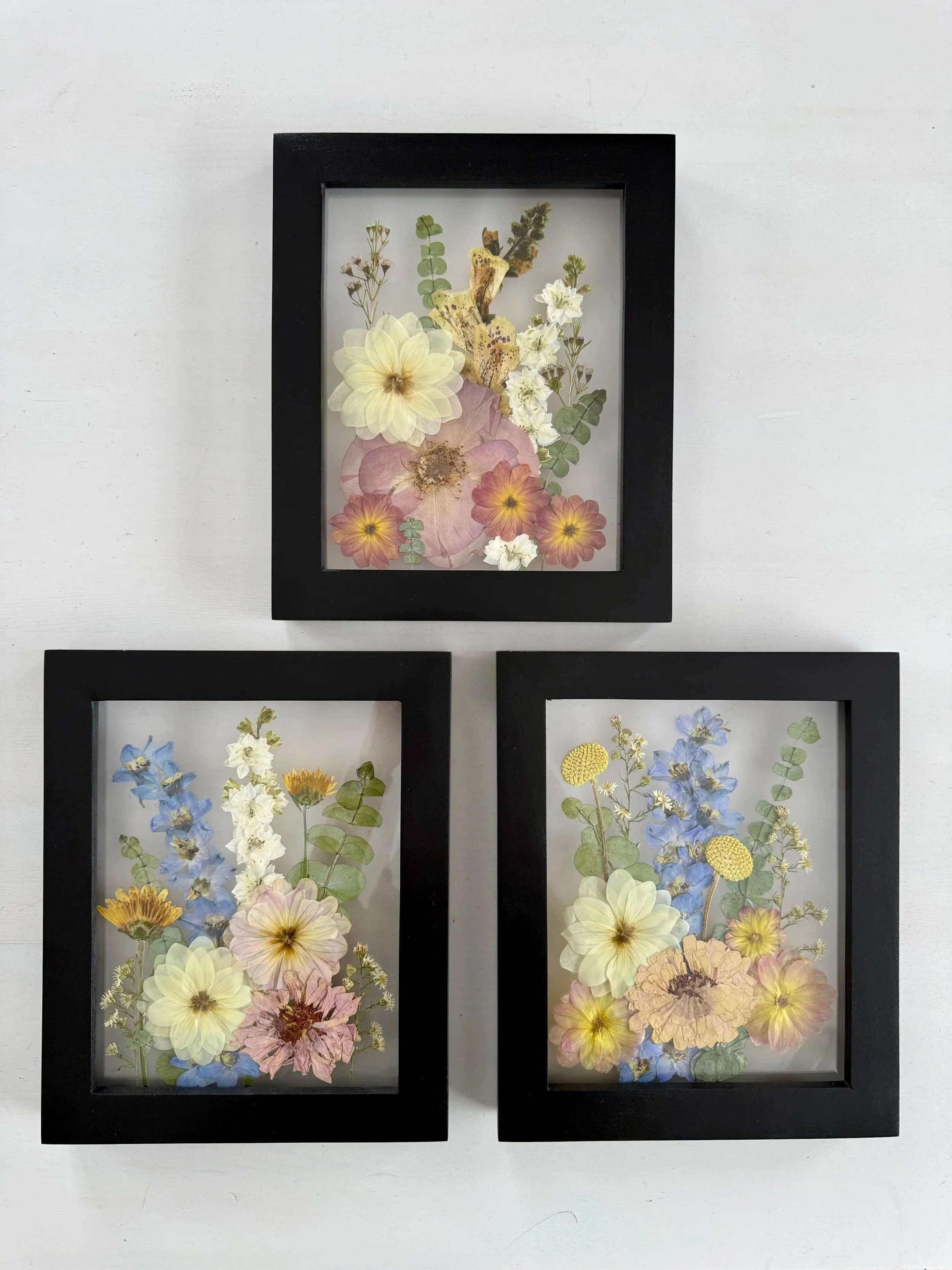 Bridal bouquet pressed and preserved, gallery wall set framed.