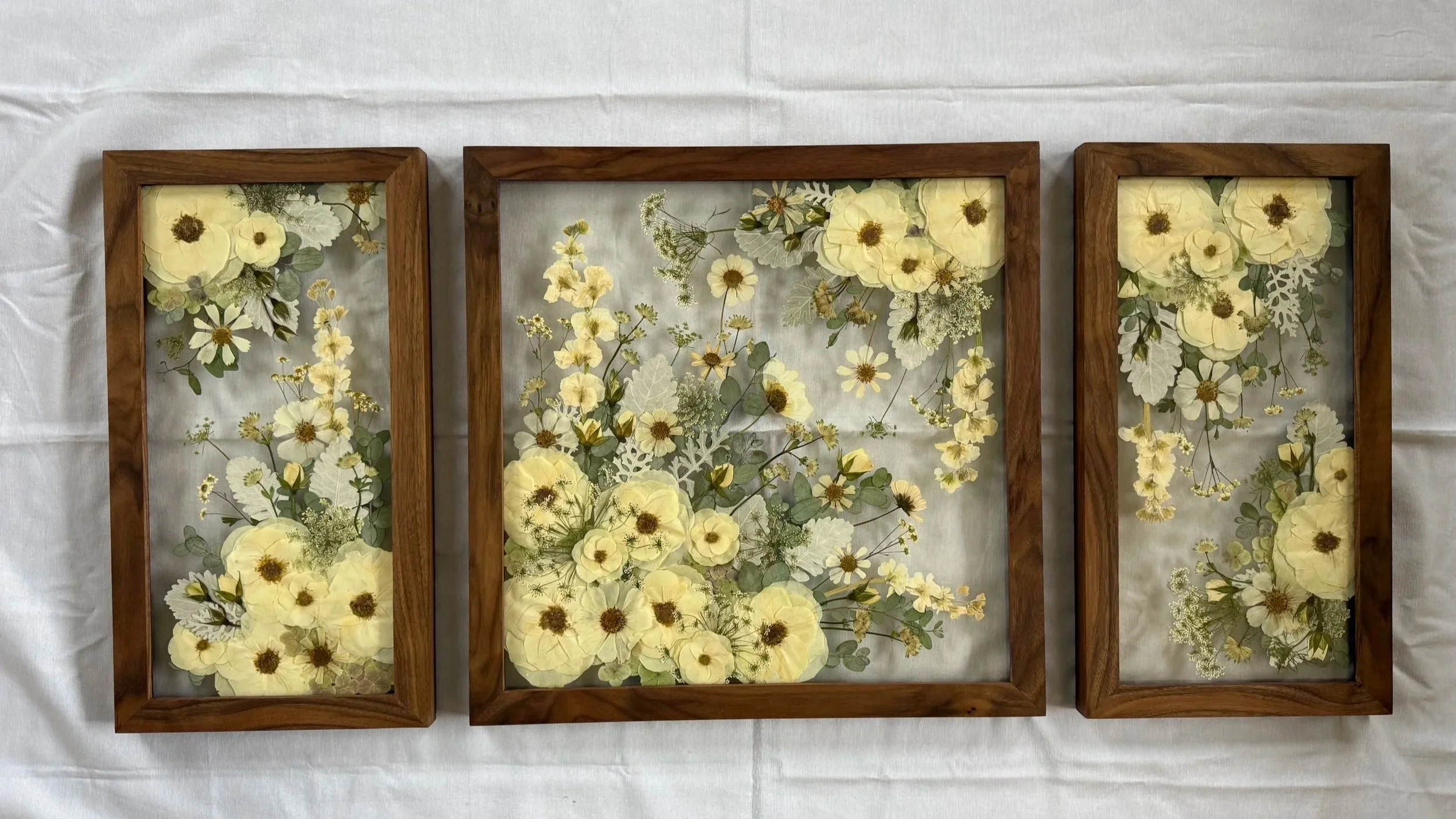 A gallery wall set of pressed flower frames.