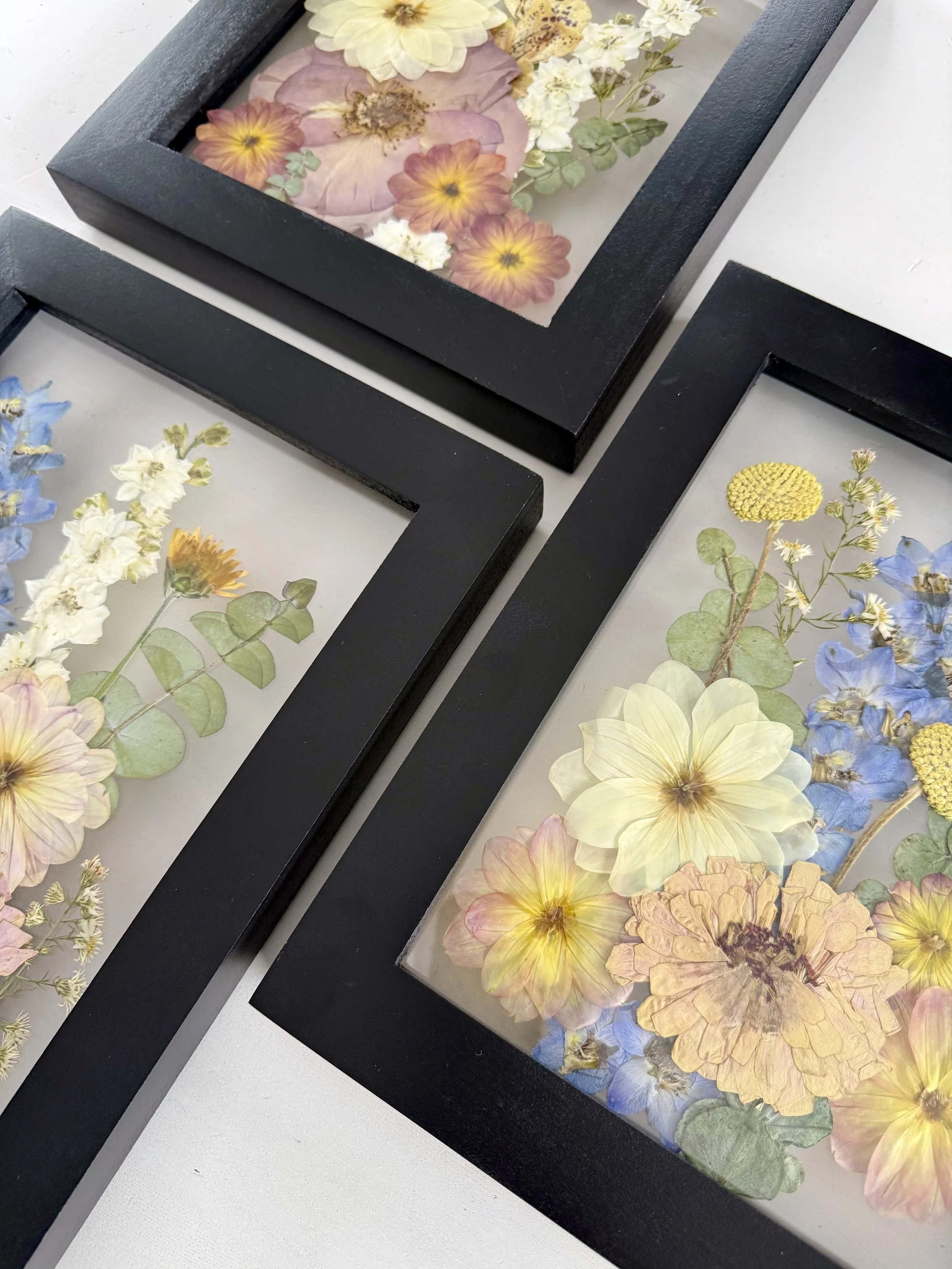 Bridal bouquet pressed and preserved, gallery wall set framed.