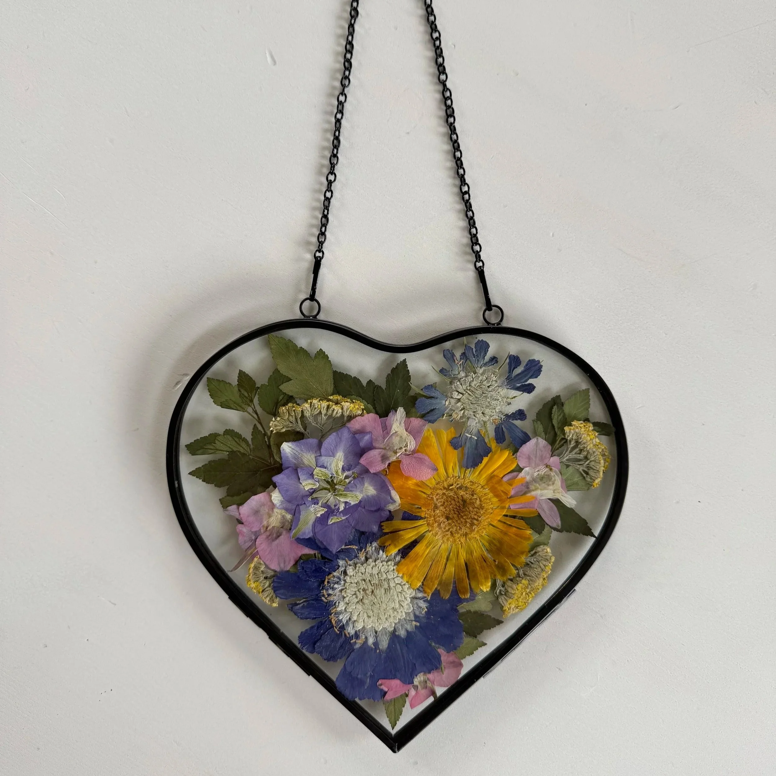 Our pressed flower workshop is a creative way to make art with our locally grown pressed flowers.