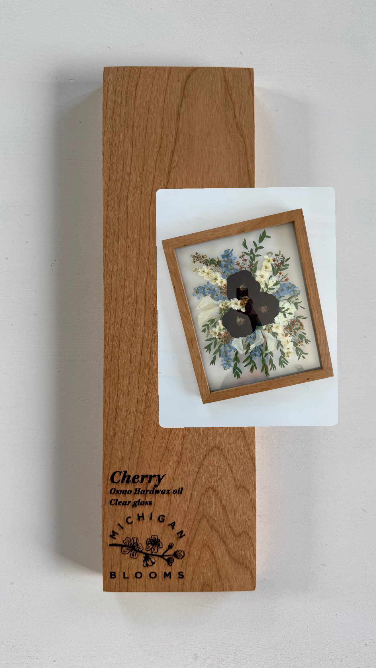 Pressed bridal bouquet in a cherry wood frame.