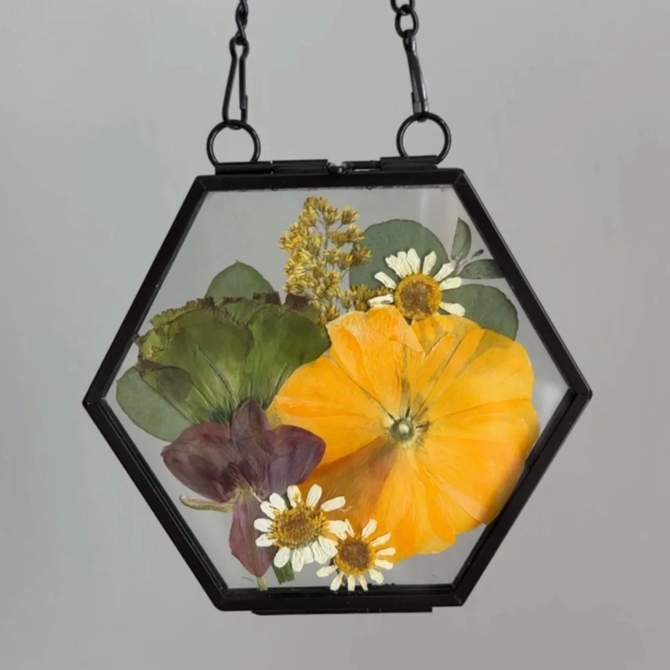 Pressed flower bridal ornament.